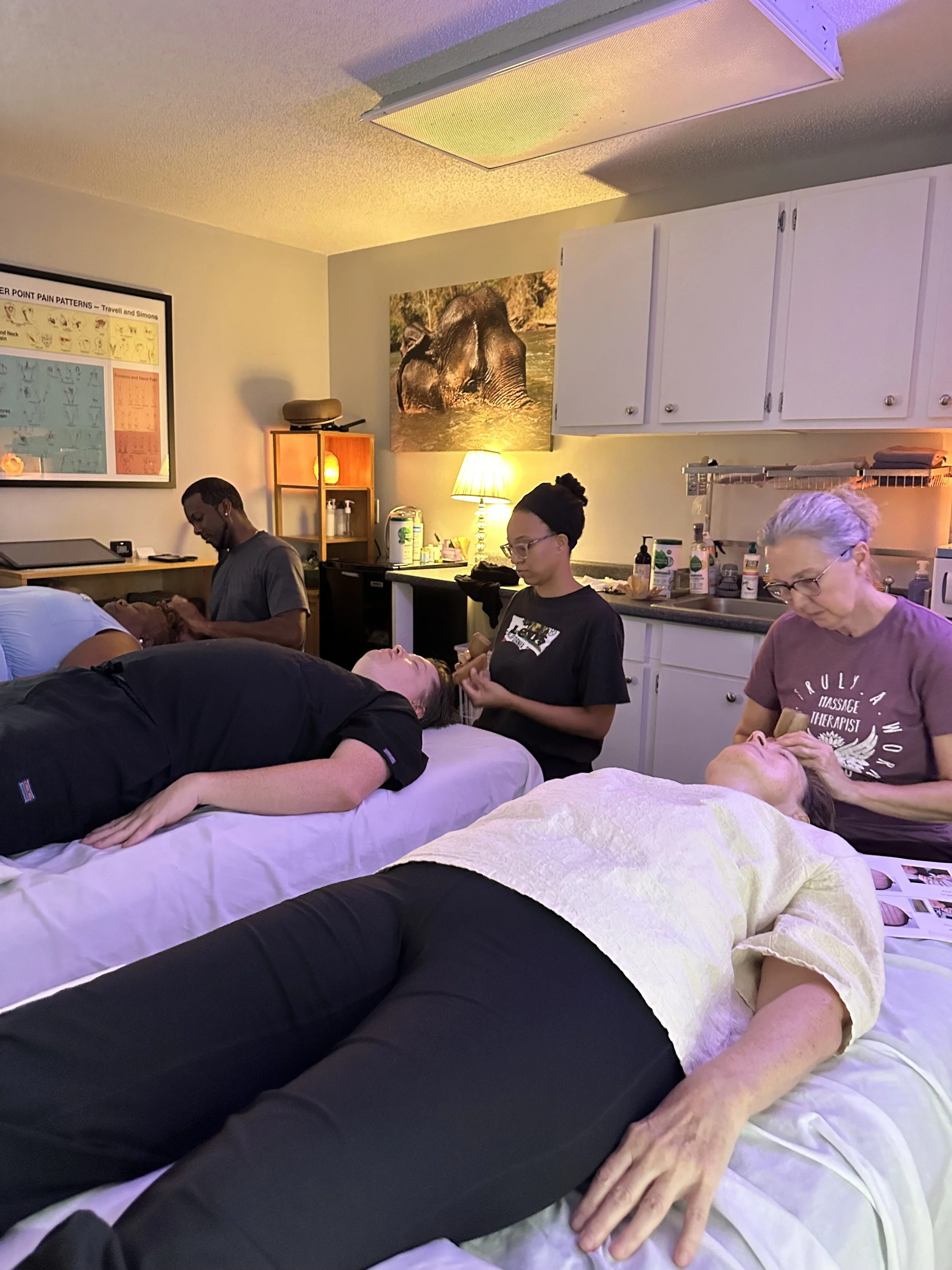 Small group massage therapy training.