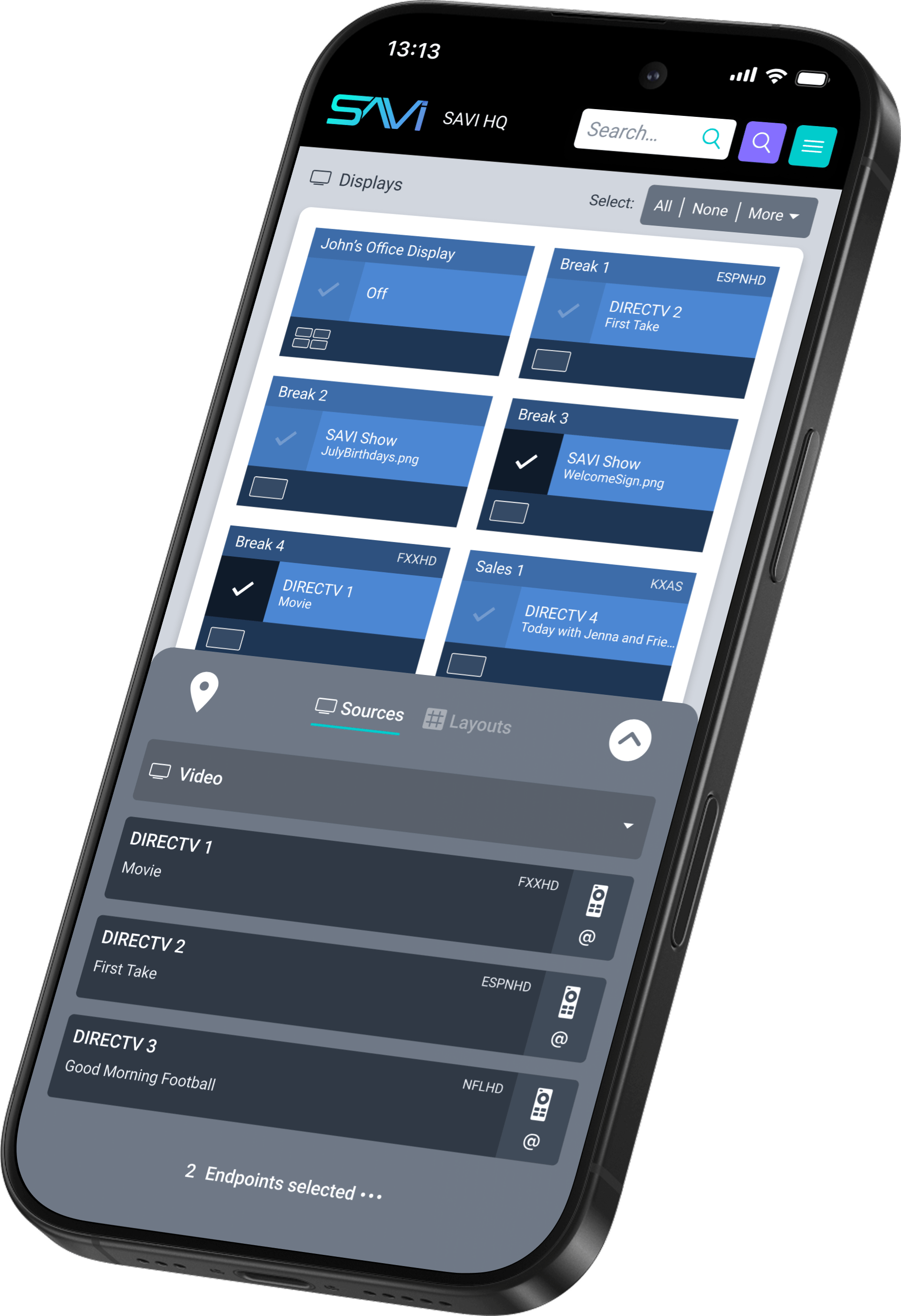Smartphone screen displaying SAVI HQ interface with multiple video source tiles and control options for managing displays and sources.