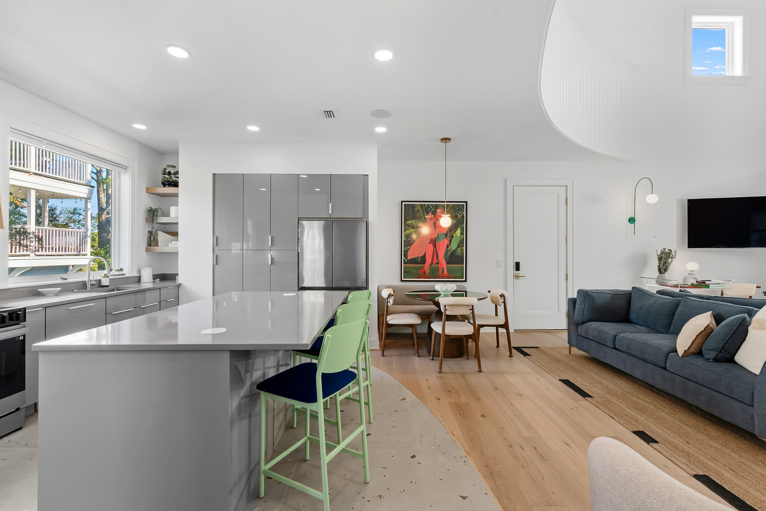 Open-concept kitchen and living area featuring clean lines, natural materials, and seamless flow for entertaining.