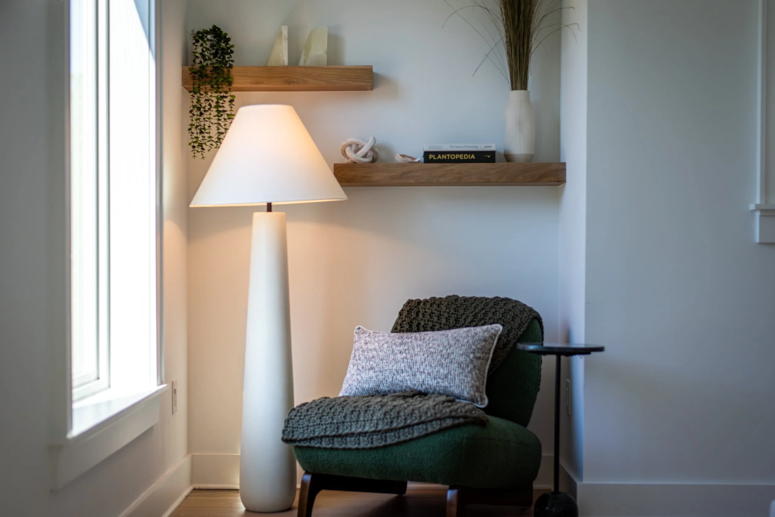Guest bathroom with green tile vanity and circular mirror at Kate’s House, a Santa Rosa Beach vacation rental.
