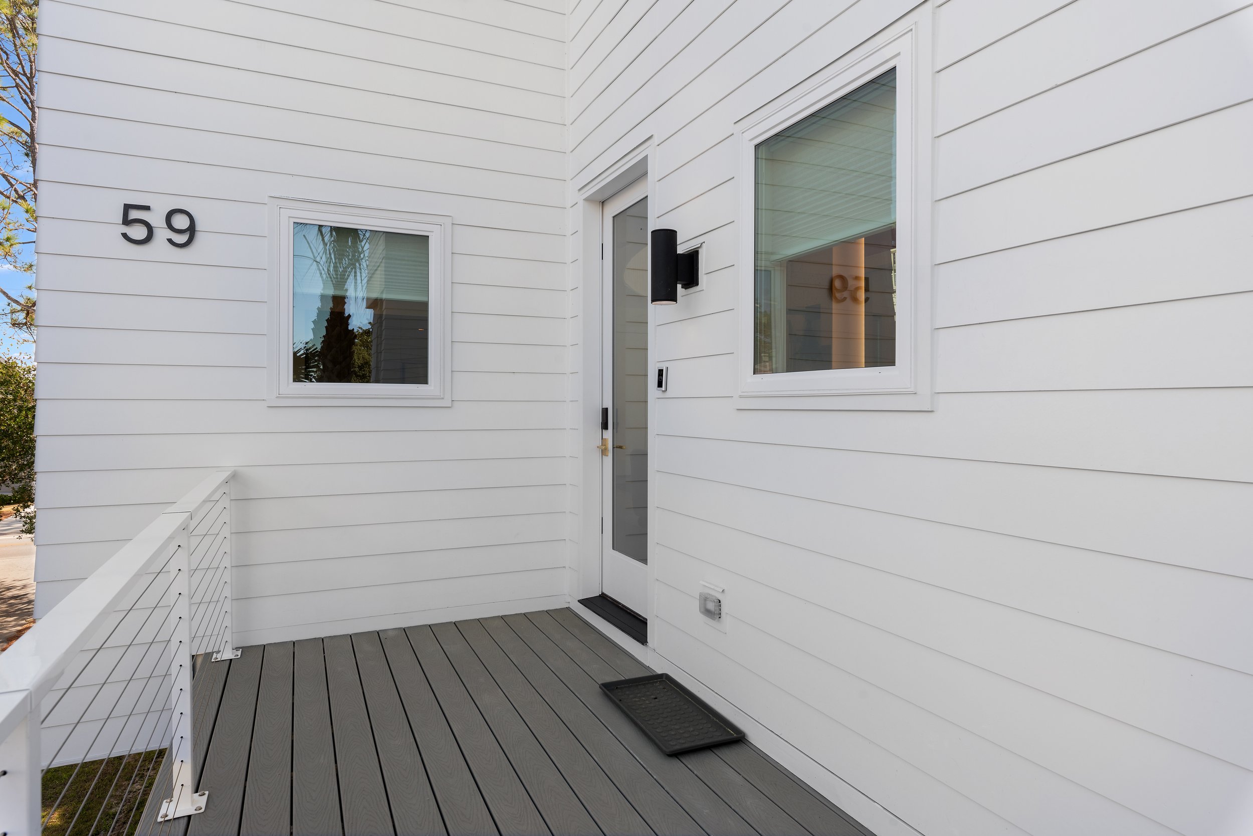 Architectural entryway to Kate’s House, designed to feel inviting and functional for families arriving from the beach.