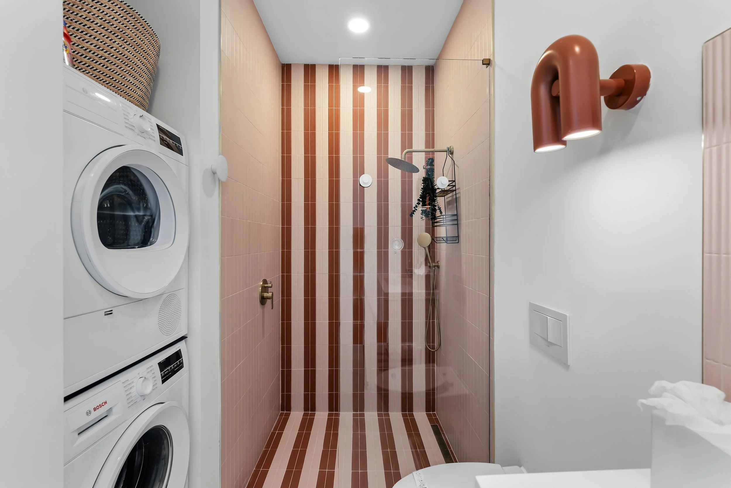 In-unit laundry area designed for longer and more comfortable stays.