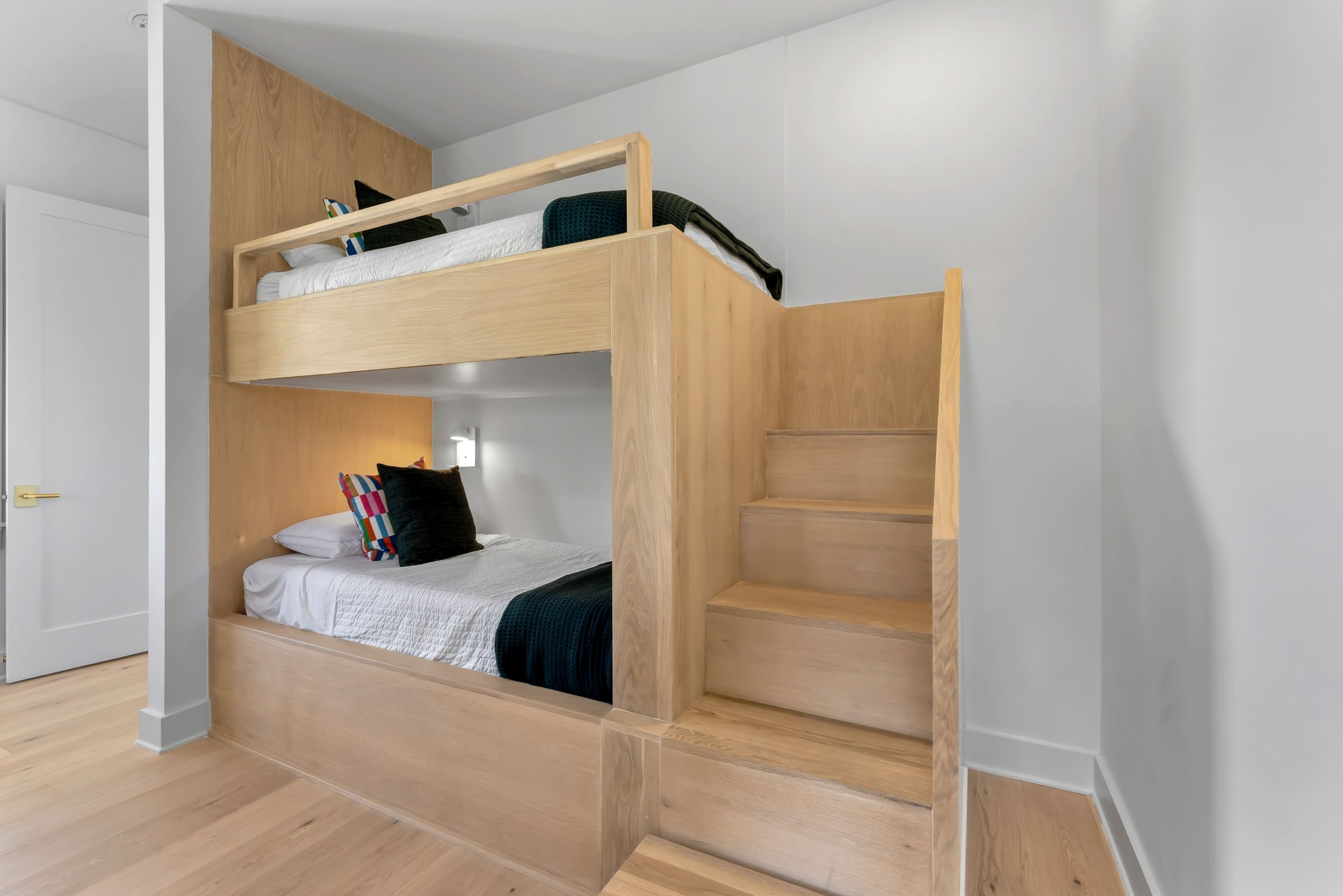 Custom built-in bunk beds add smart, space-efficient sleeping for families—designed with comfort, durability, and thoughtful detailing in mind.