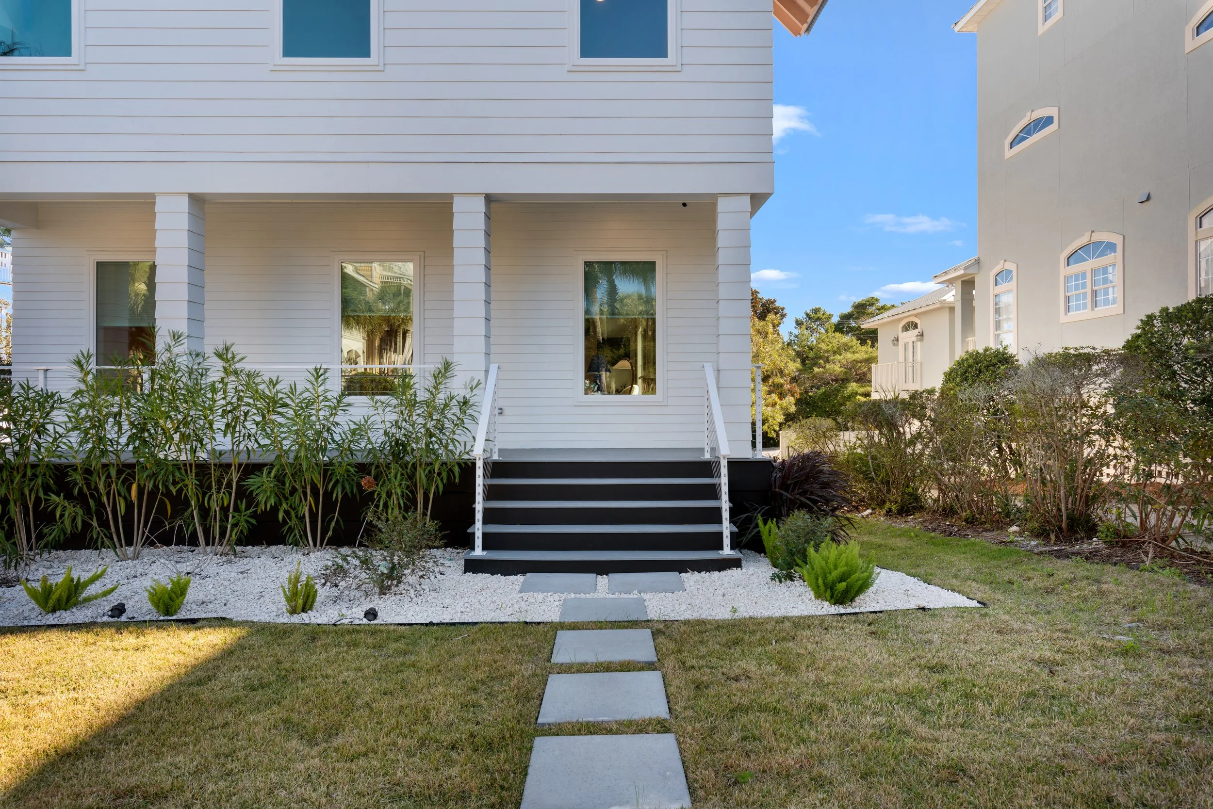 Main entry of Kate’s House, a design-forward beach home in Santa Rosa Beach, welcoming guests with clean coastal architecture and thoughtful detailing.