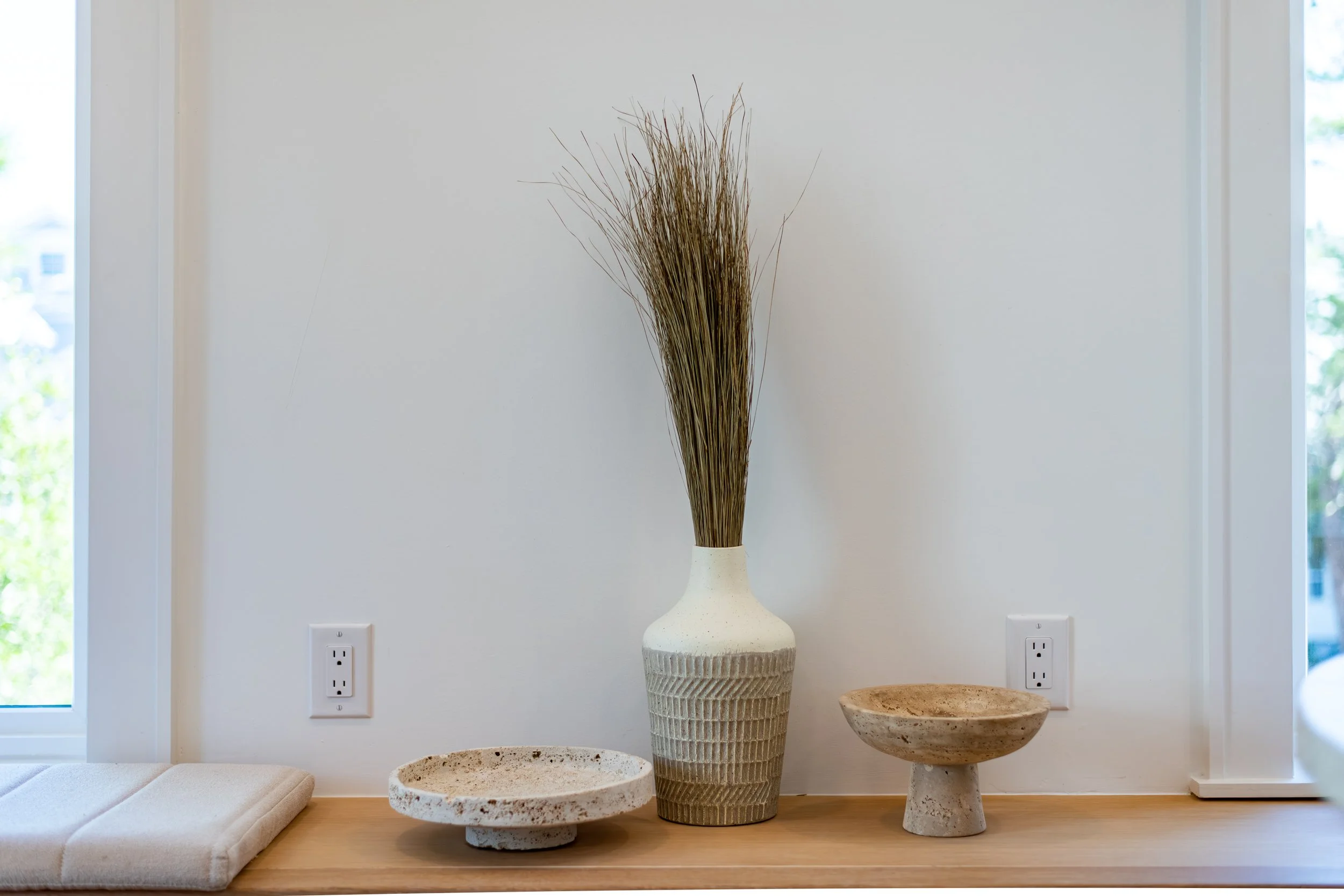 Guest house interior styling detail showcasing custom finishes and coastal textures.