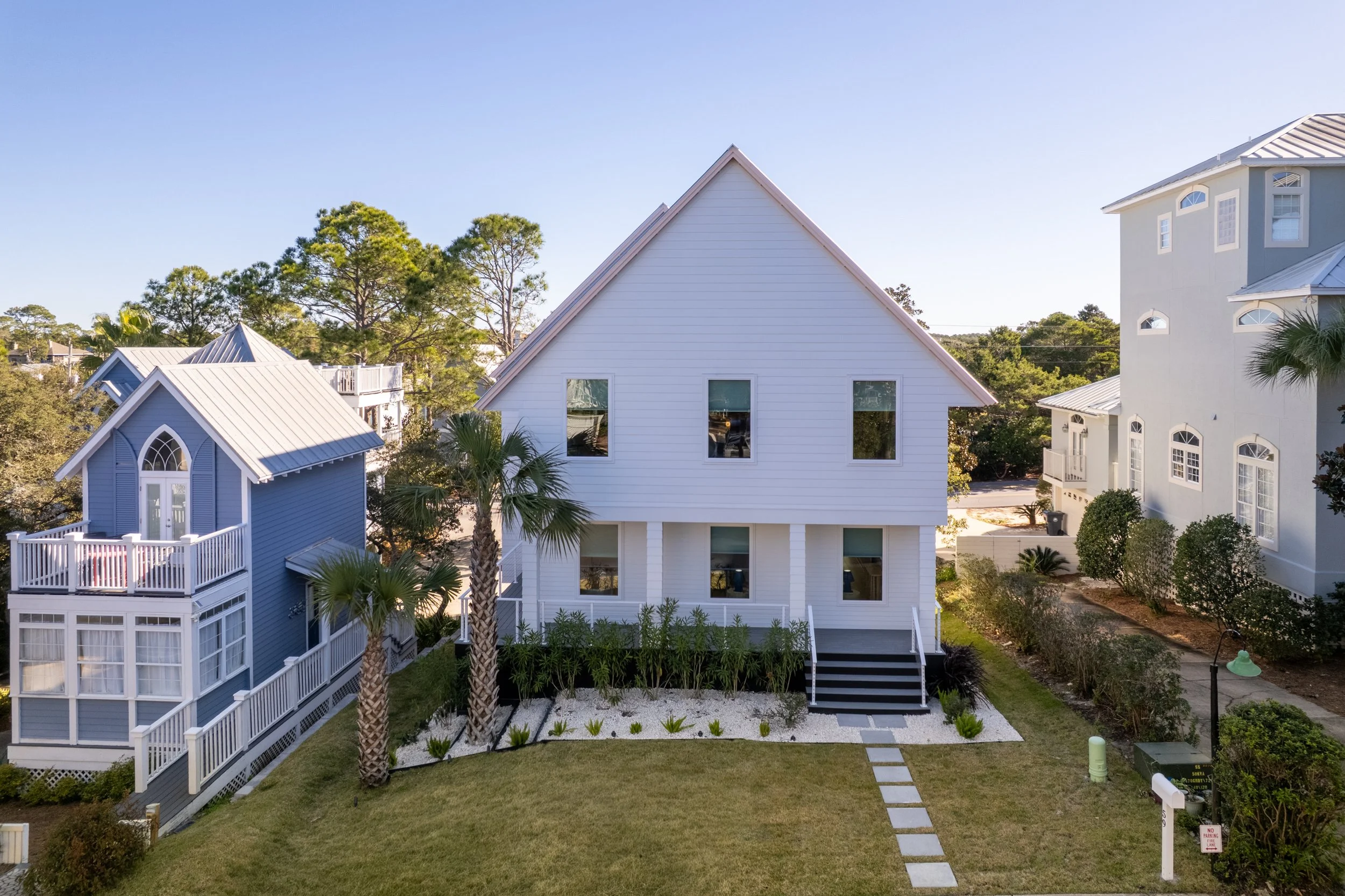 Front exterior of Kate’s House, a thoughtfully designed coastal retreat along Scenic Highway 30A, featuring clean architectural lines, curated landscaping, and easy access to nearby beach amenities.
