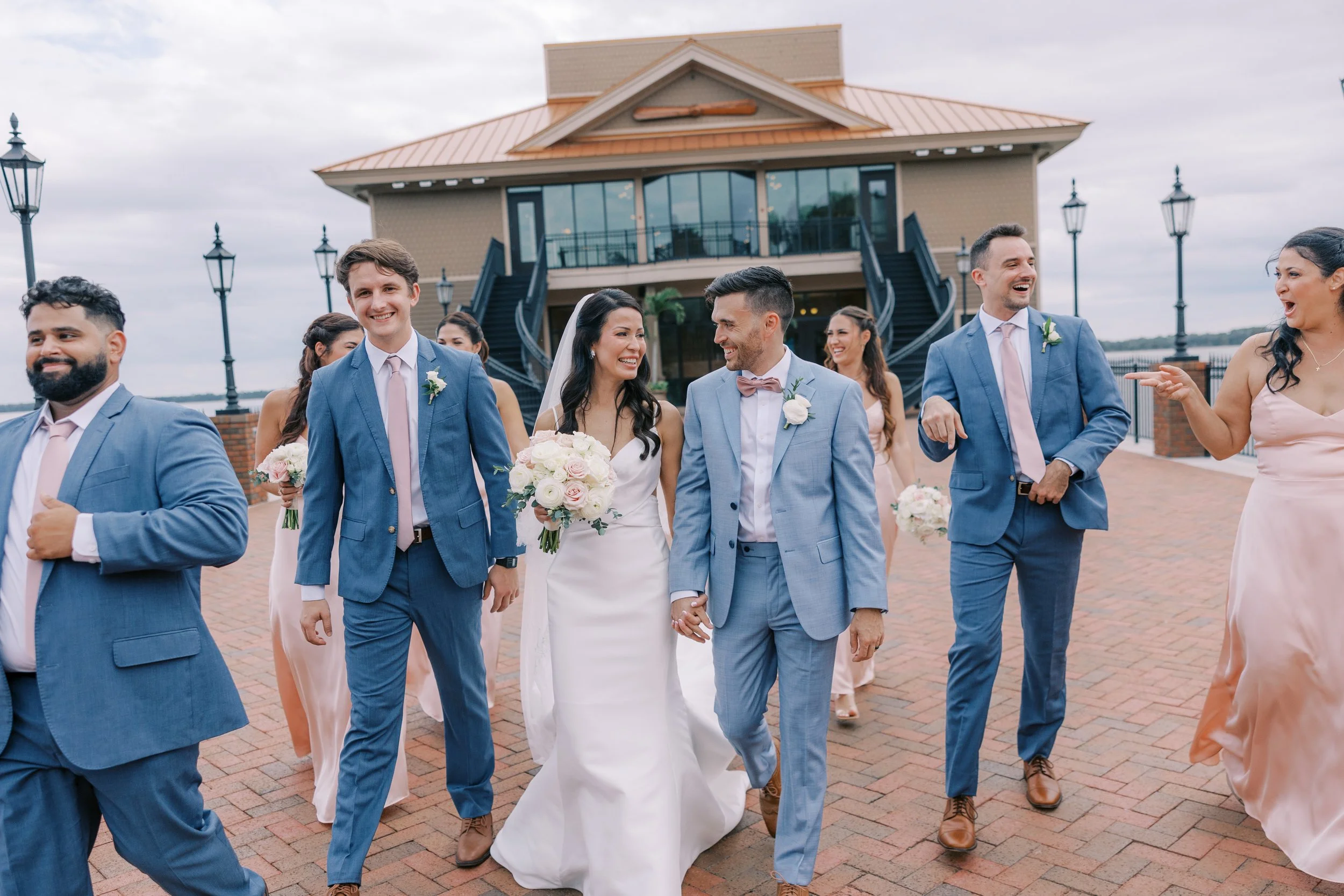 Bridal Party happily walks out of wedding ceremony celebrating at Tavares Pavilion on the Lake