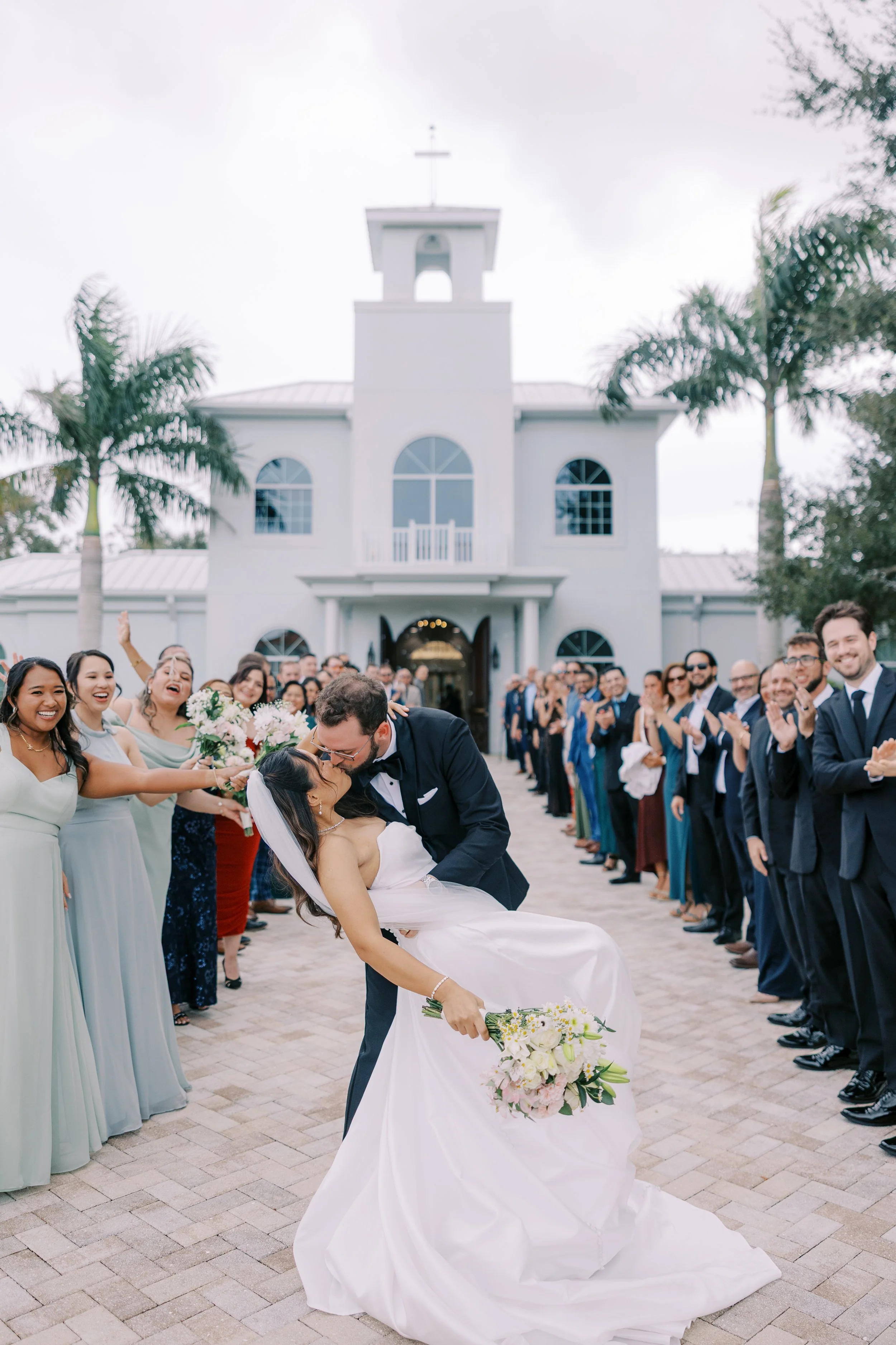 Bride and groom dip kiss Florida wedding photography