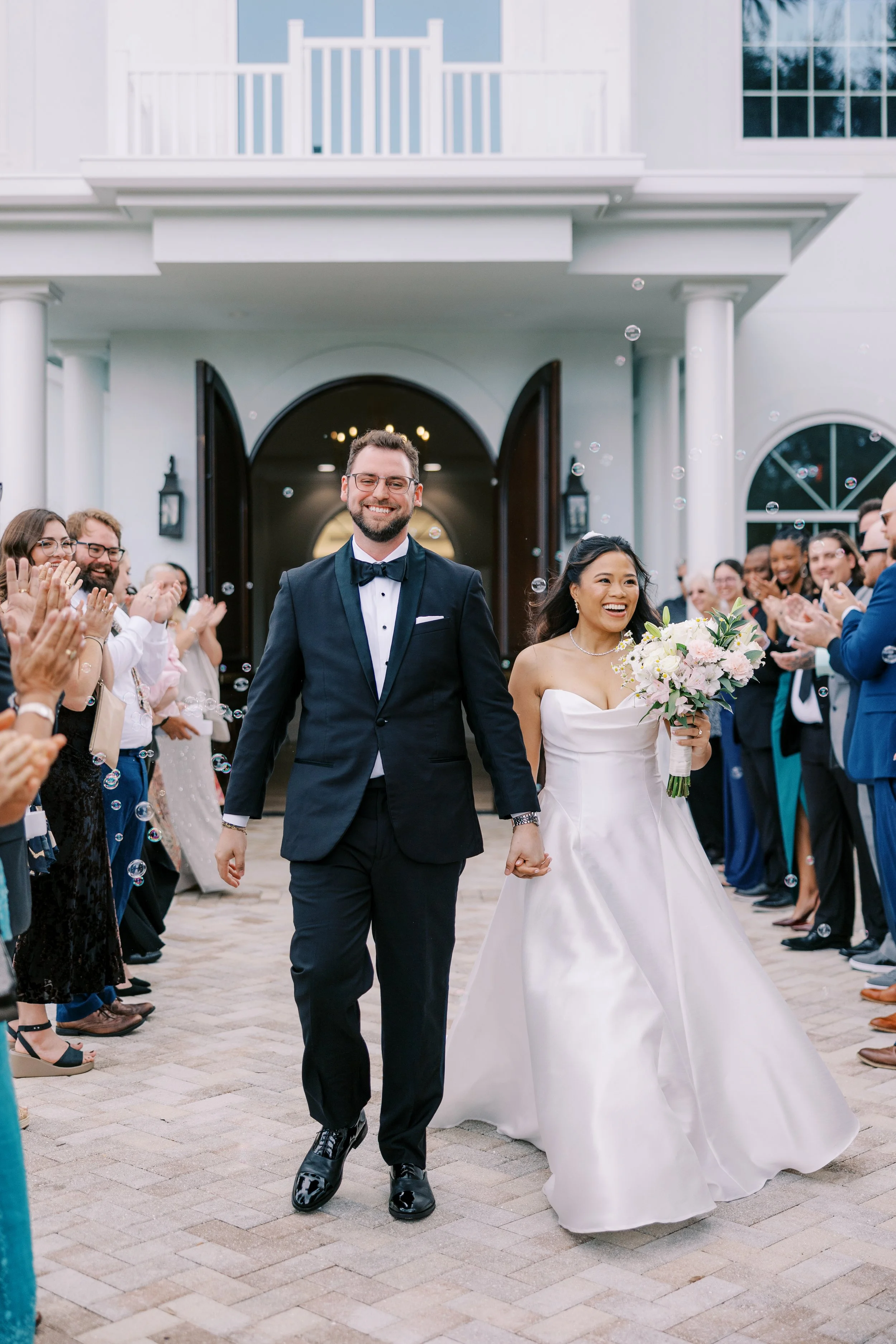 Bride and groom exit their ceremony at Harborside Chapel in Safety Harbor Florida