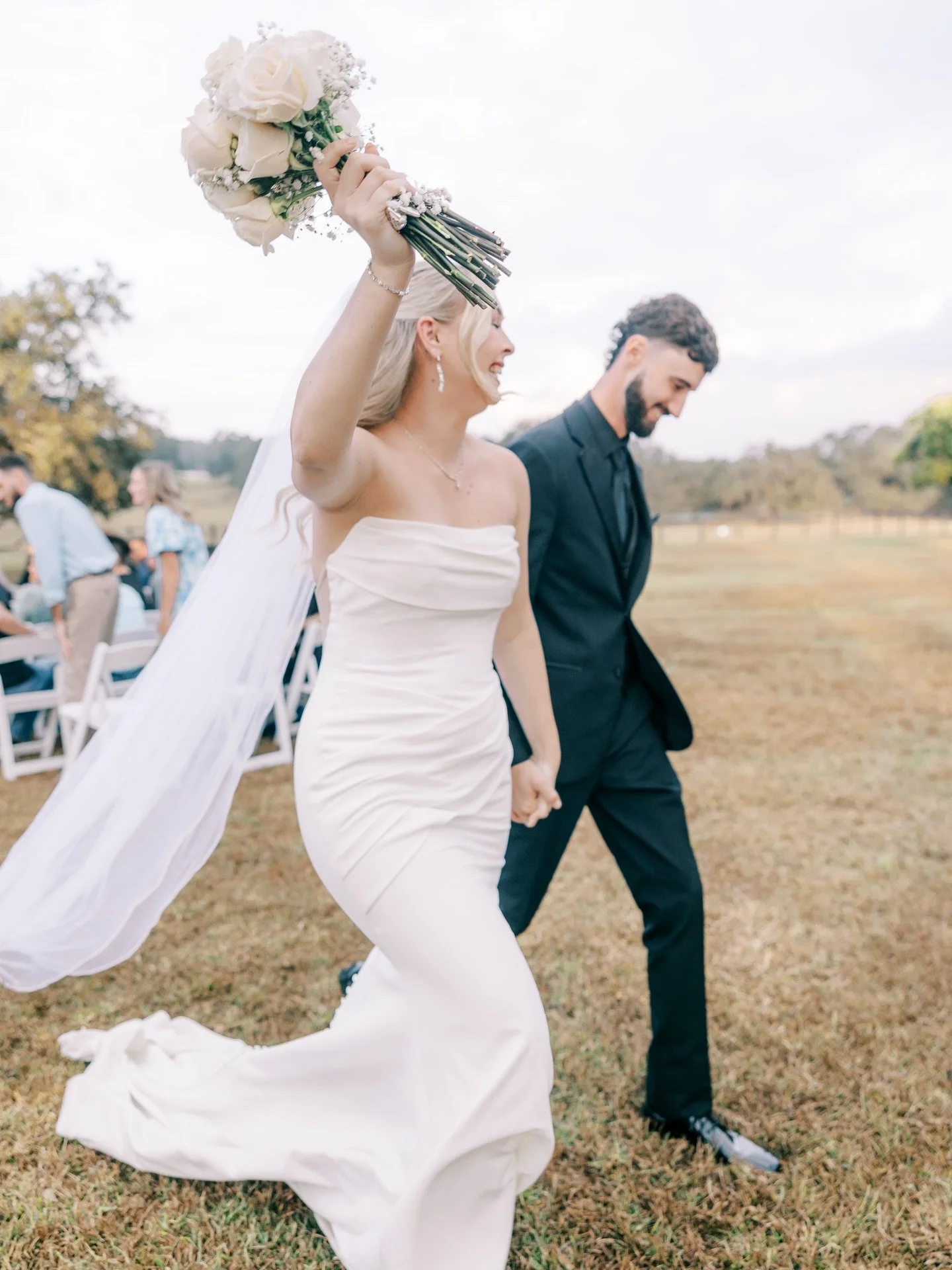 It poured before their ceremony&hellip; and somehow it still started on time. ✨

Shoutout to their incredible team for towel-drying every chair and this fun-loving couple who loves to celebrate with a good champagne spray: One on wedding day with the