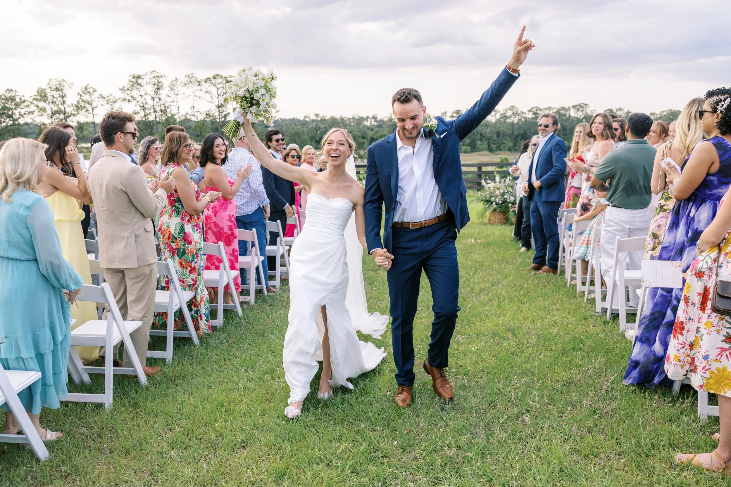 bride and groom celebrate after their wedding ceremony at the Bloomfield Venue Orlando Florida wedding photos