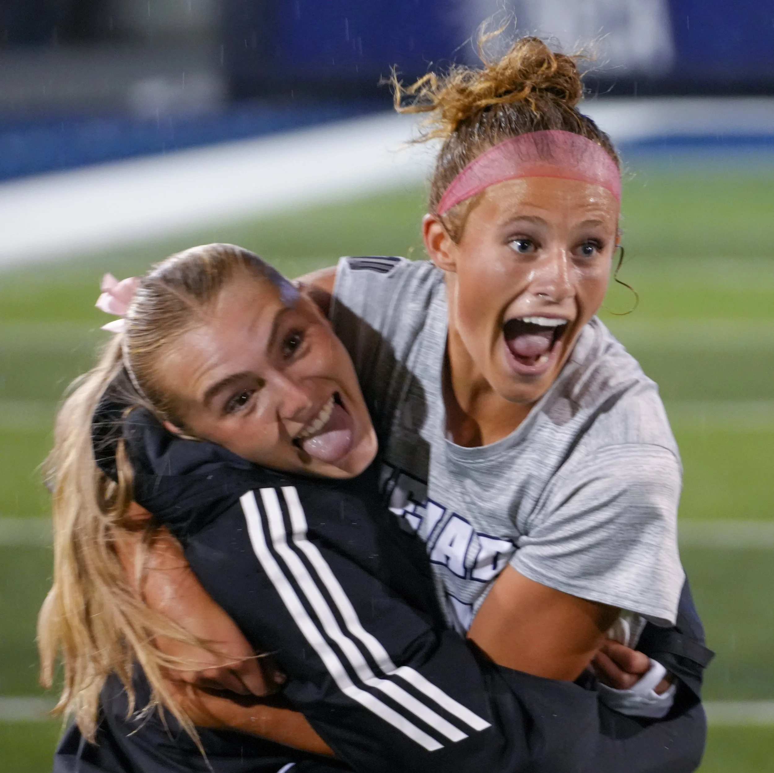 Post Game_Larson12 and McCusker21_Hugging.jpg