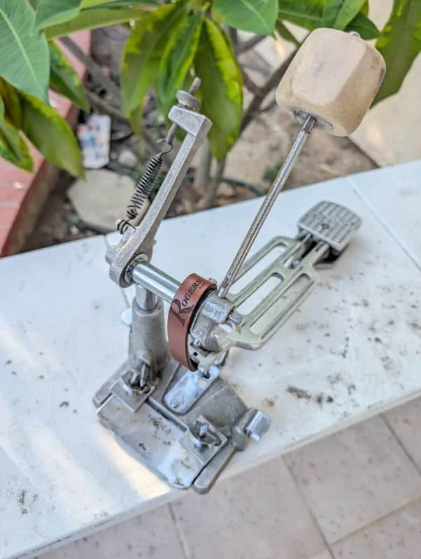 bass drum pedal on white shelf