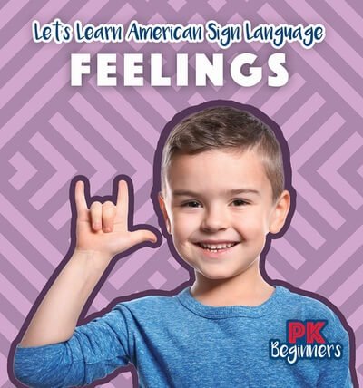 Front Cover of a Rosen Publishing book with a smiling boy signing "I LOVE YOU" in American Sign Language. The book is called "FEELINGS" and was illustrated by 35 Corks Art Studio.