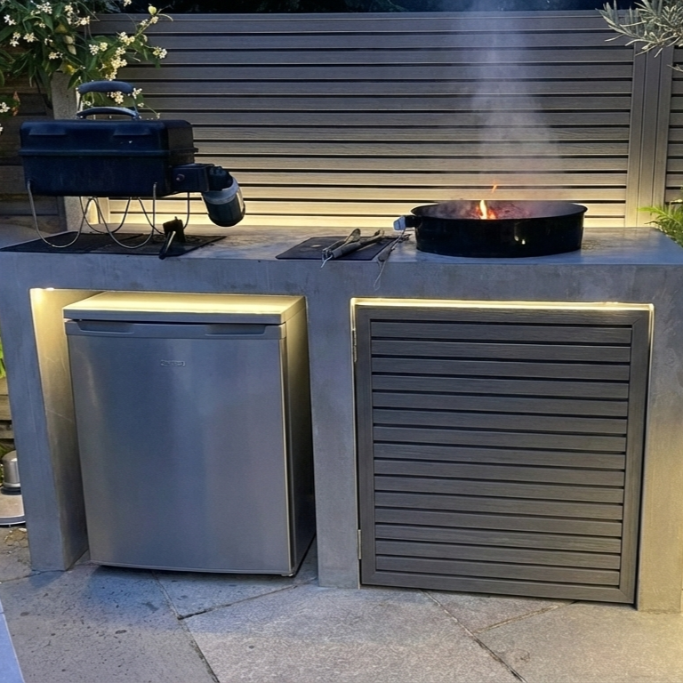 Garden texture illuminated by 2700K warm white LED grazing lights at night.