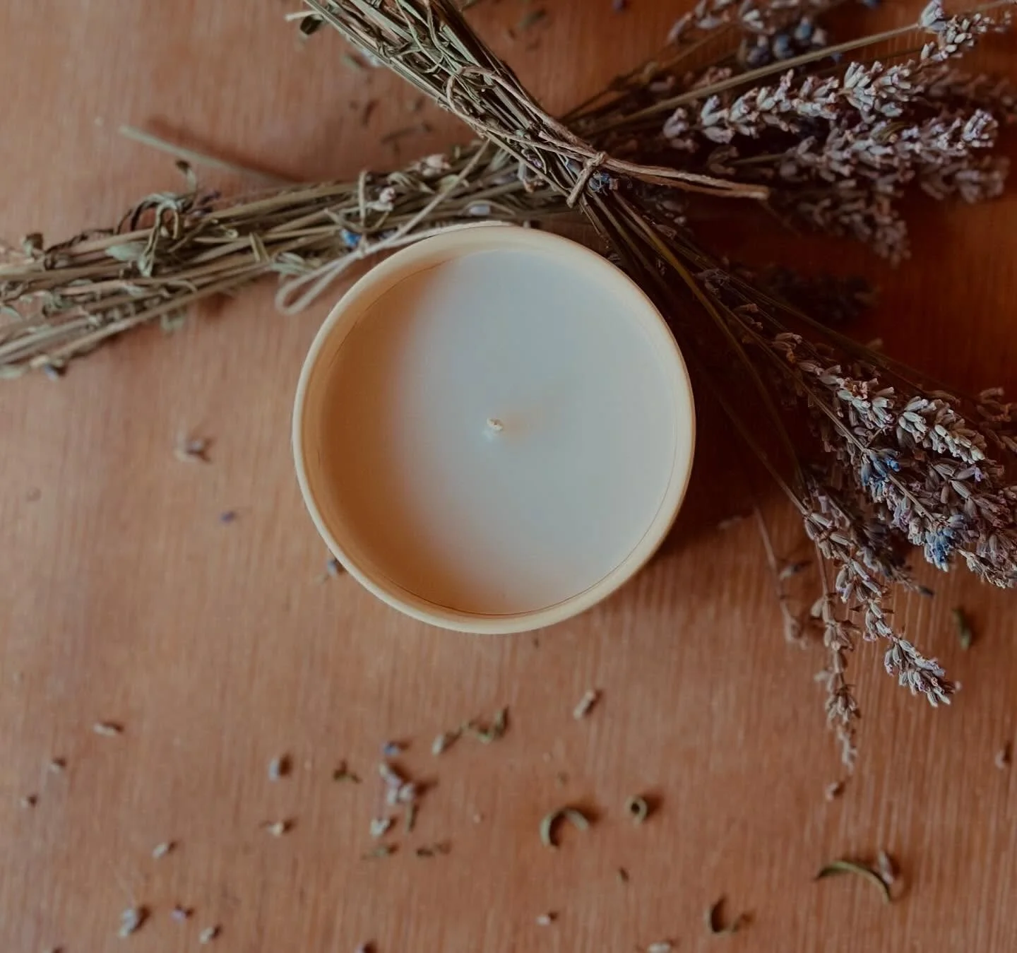 I was trying to get a photo of my Lavender Milk &amp; Honey candle for my website while fending off my grabby one year old. He managed to grab a handful of dried lavender off the stems and it scattered around the candle. I should have trusted his exp