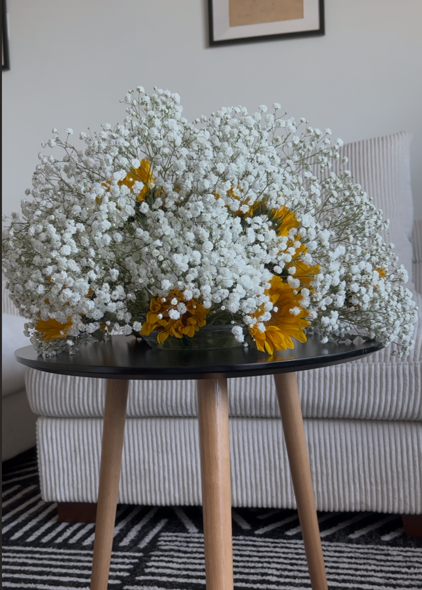 Airy “Cloud” Installation Moment — a full baby’s-breath design with sunflowers, created for bright, high-impact styling in modern spaces.
