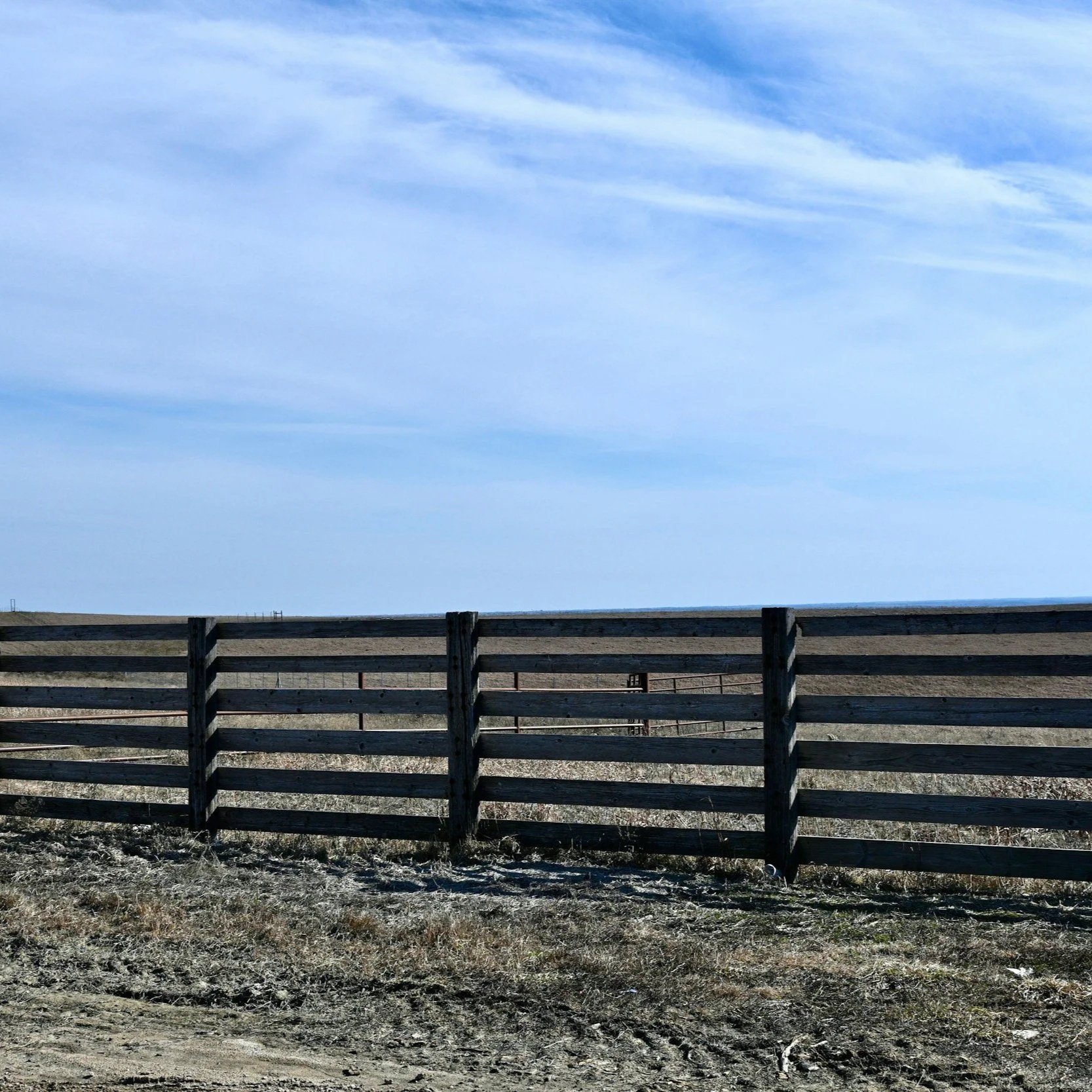 Horizontal residential privacy fence demonstrating modern vinyl or composite fencing designed for durability against sunlight, storms, and outdoor exposure.
