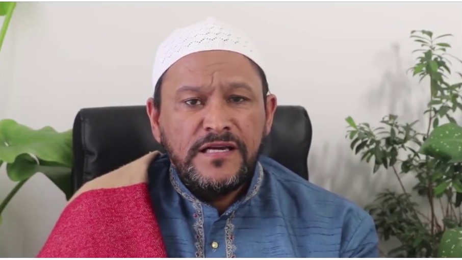 Thumbnail of "Stories of Prophet Lot - are they about homosexuality?" 

Imam Muhsin Hendricks wearing a white cap (kufi) and thobe, sitting in front of a white wall with plants behind him.