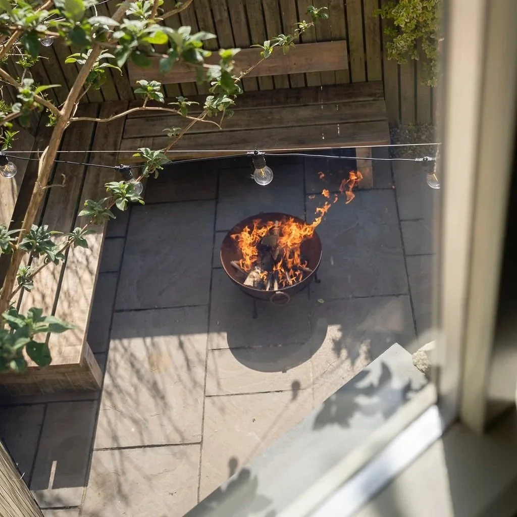 Fire pit on private terrace overlooking the Cornish countryside near Stargazey.