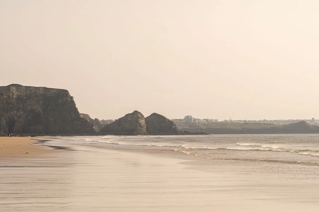 Sandy beach and coastline near Watergate Bay in North Cornwall.