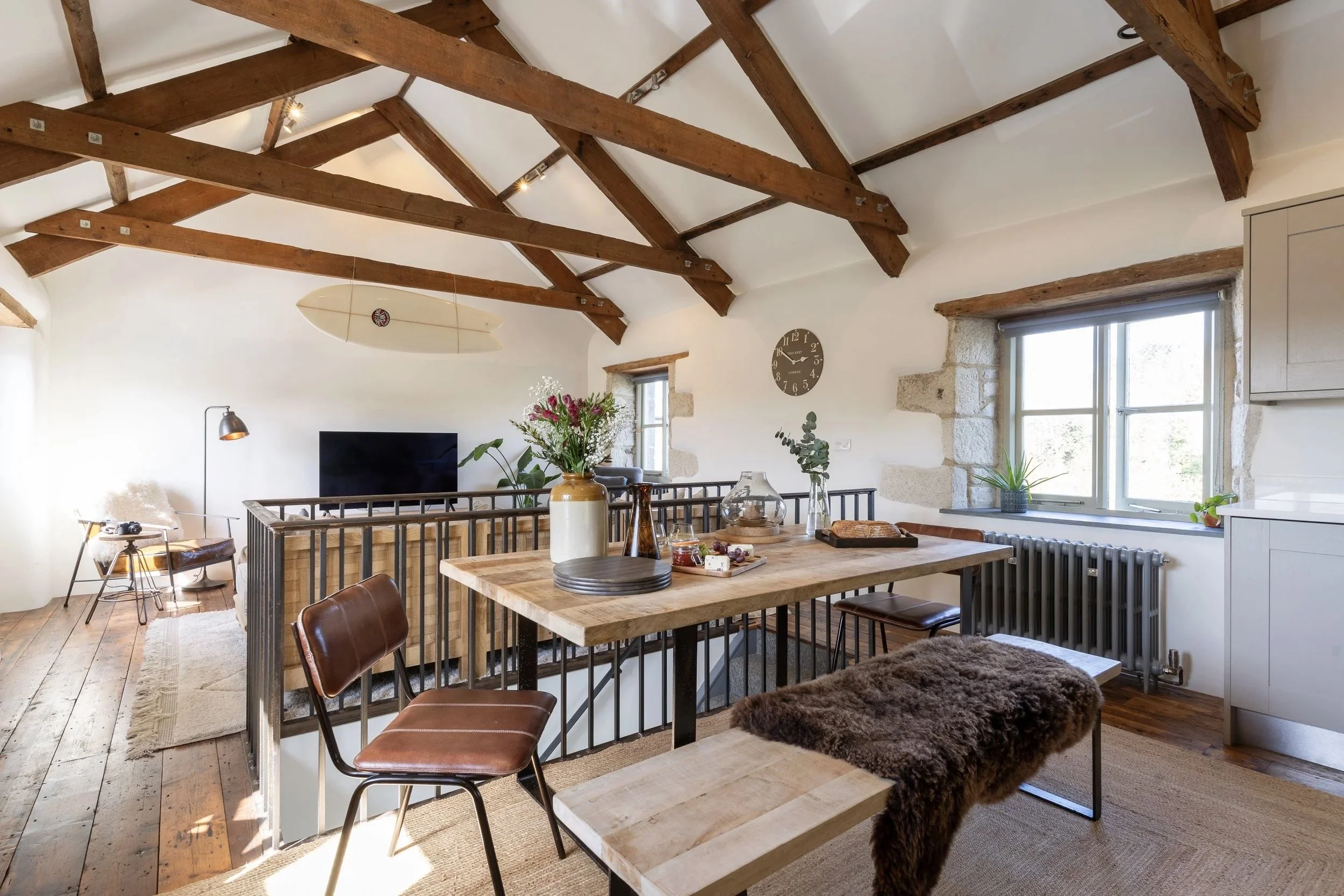Dining area at Stargazey with wooden table and natural light — crafted for gathering.