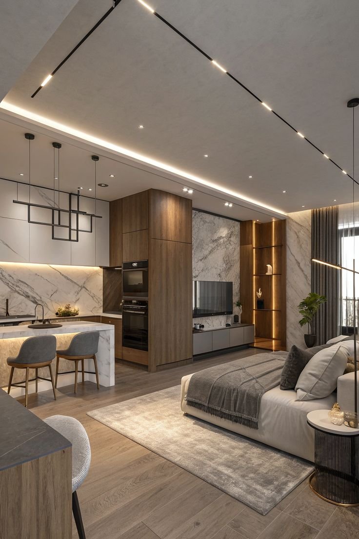 Modern living room with marble accents and a ceiling with integrated lighting.