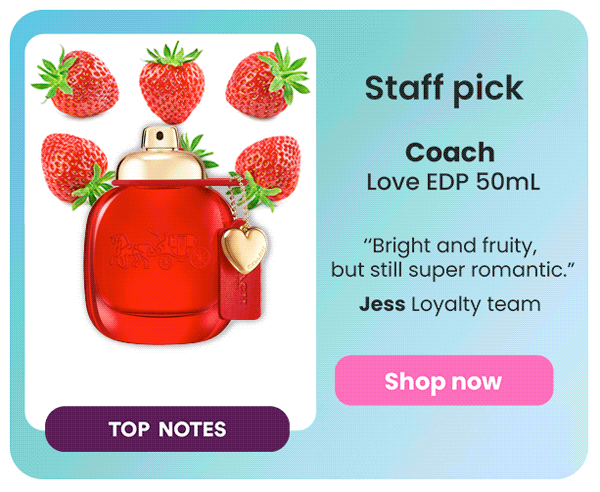 Red perfume bottle with a gold heart-shaped charm surrounded by fresh strawberries on a light blue background, with promotional text for Coach Love EDP 50ML and a 'Shop now' button.