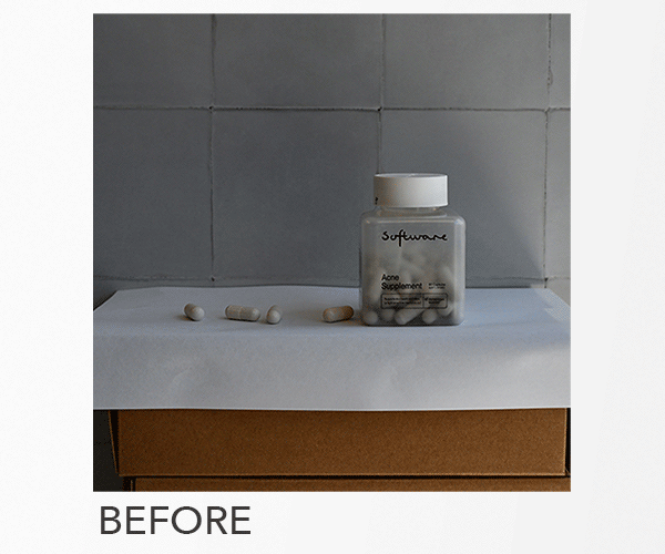 A transparent pill bottle labeled "software" containing capsules, three loose capsules, and a cardboard box underneath on a white surface against a tiled wall.