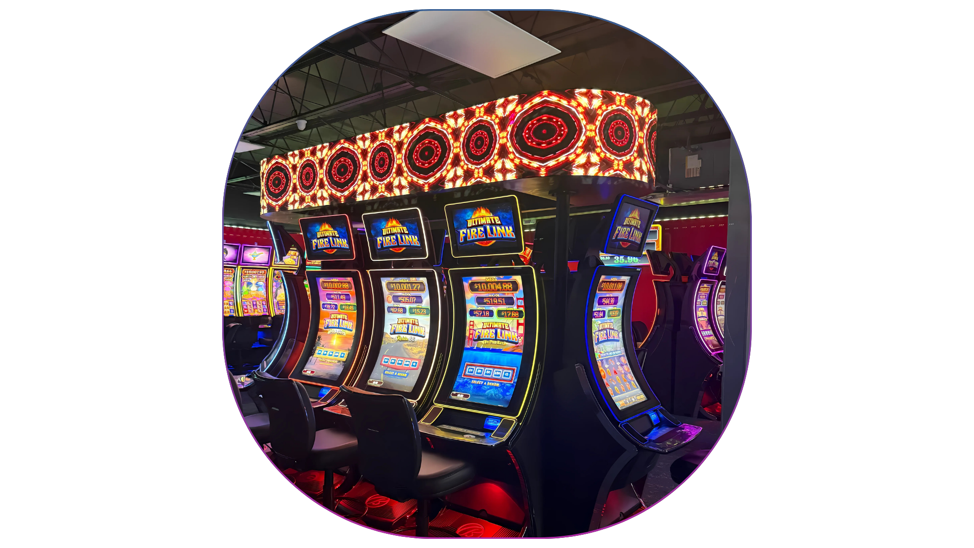 Row of brightly lit slot machines with colorful screens in an arcade or casino setting.