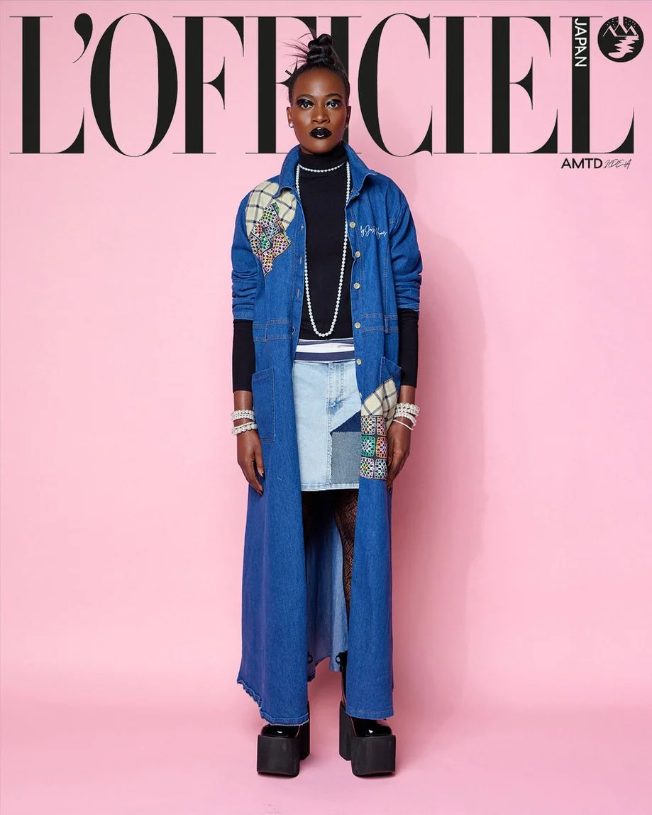 

JUS10H Tokyo Remote Collection NYFW 2025 — model Florence in floor-length medium-wash denim coat with plaid and multicolor mosaic embroidered patchwork panel and JUS10H script, layered over a light-wash patchwork denim mini skirt, black turtleneck,