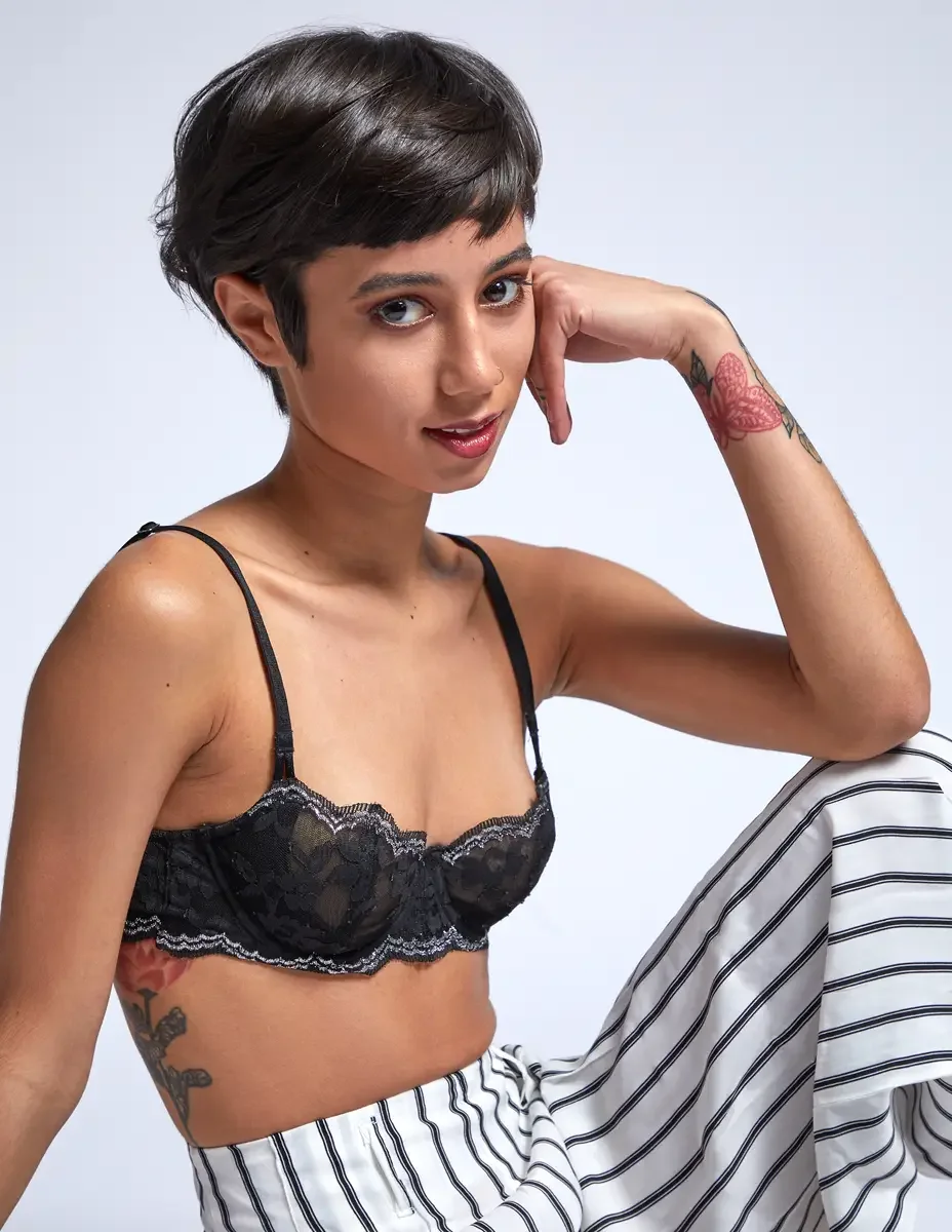 Eloissa, portrait, hand raised, gold hoop earrings and chain necklace, floral wrist tattoo, East Williamsburg studio test shoot, makeup by Schanica Pickens, photographed by Scott Parker Photo