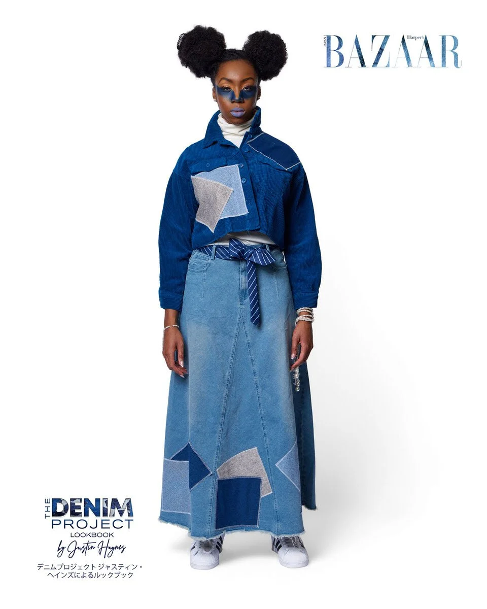 JUS10H Denim Project 2025 Harper's Bazaar Japan lookbook — model in deep indigo corduroy cropped jacket with geometric light-wash denim appliqué over floor-length patchwork denim maxi skirt with striped tie belt at waist, pearl bracelets, Adidas Supe