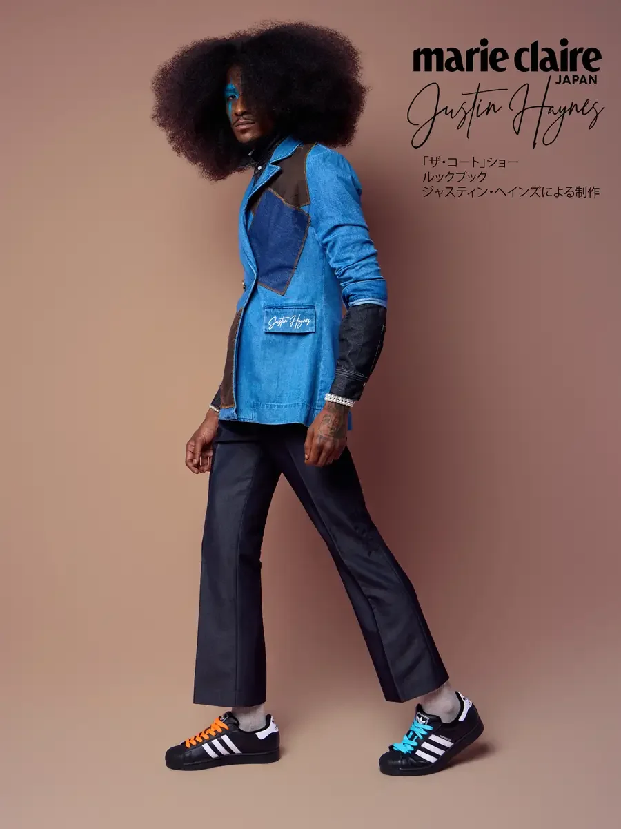 Double breasted denim jacket in motion, glancing back over the shoulder, JUS10H Court Show lookbook, photographed by Scott Parker Photo for Marie Claire Japan