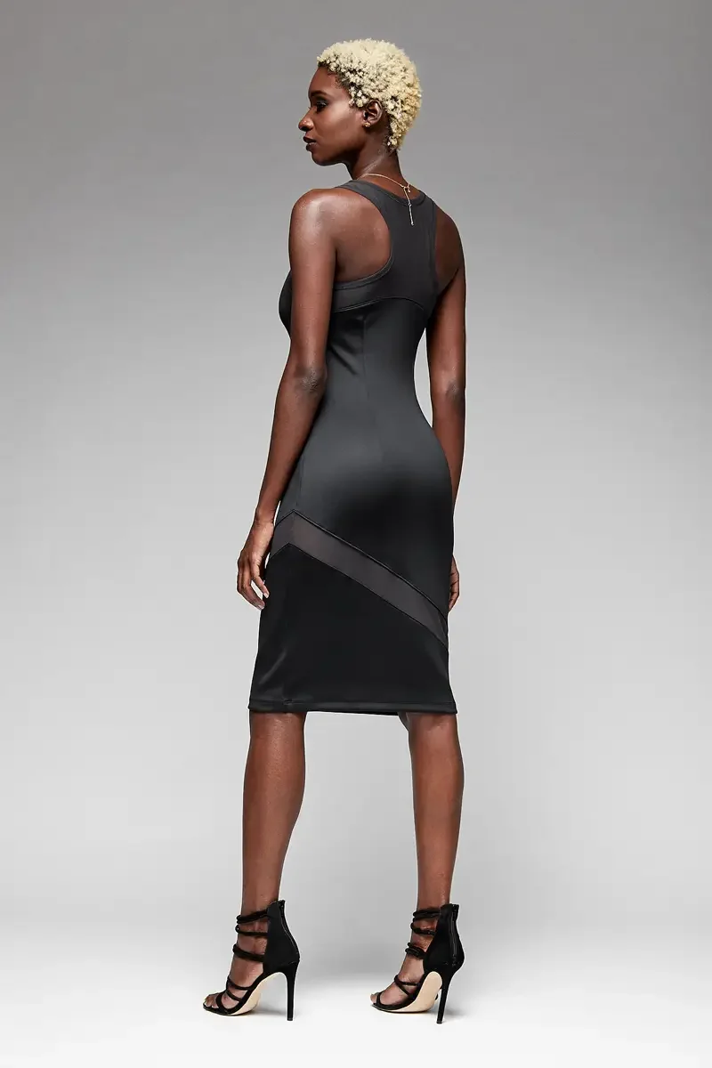 Minika Ko lookbook, black bodycon midi dress, back view, mesh panel insert at diagonal hem, racerback silhouette, photographed by Scott Parker Photo