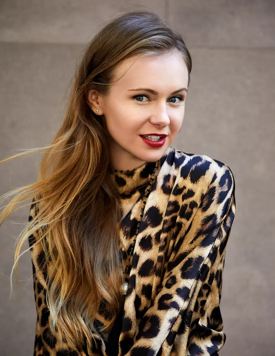 Julia, close-up portrait, leopard print satin batwing-sleeve dress with high mock neck and black bead choker with pendant necklace, Upper East Side street test shoot, photographed by Scott Parker Photo