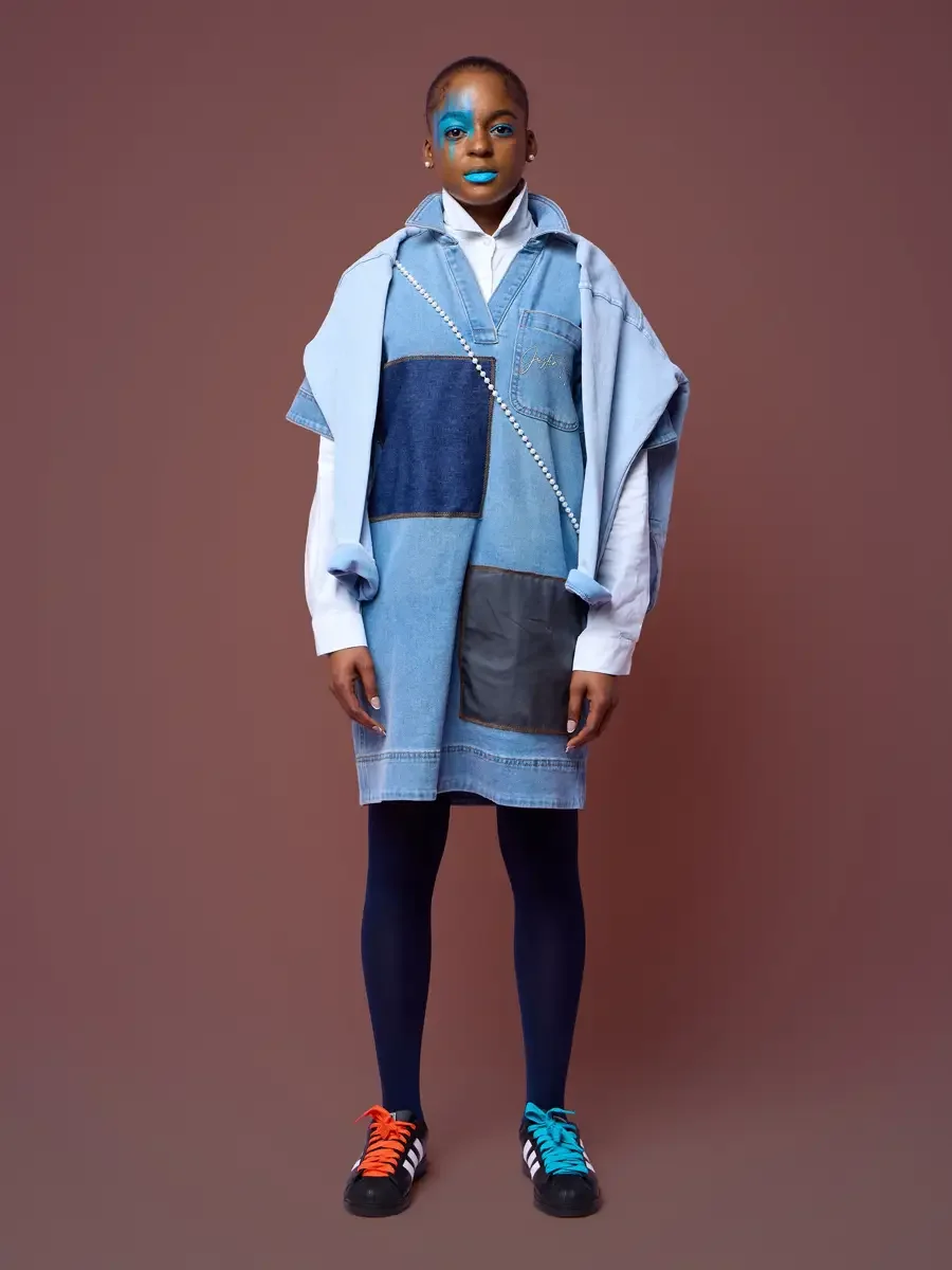 Box cut denim dress over a white shirt with pearl strand and navy tights, JUS10H Court Show lookbook