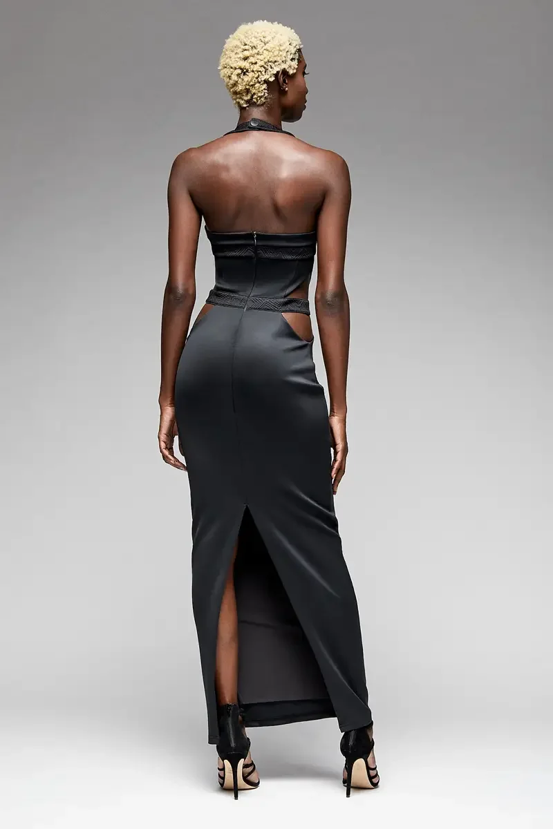 Minika Ko lookbook, black halter gown, back view, open back with geometric patterned halter strap, cutout at hip, center back slit, smooth synthetic skirt, photographed by Scott Parker Photo