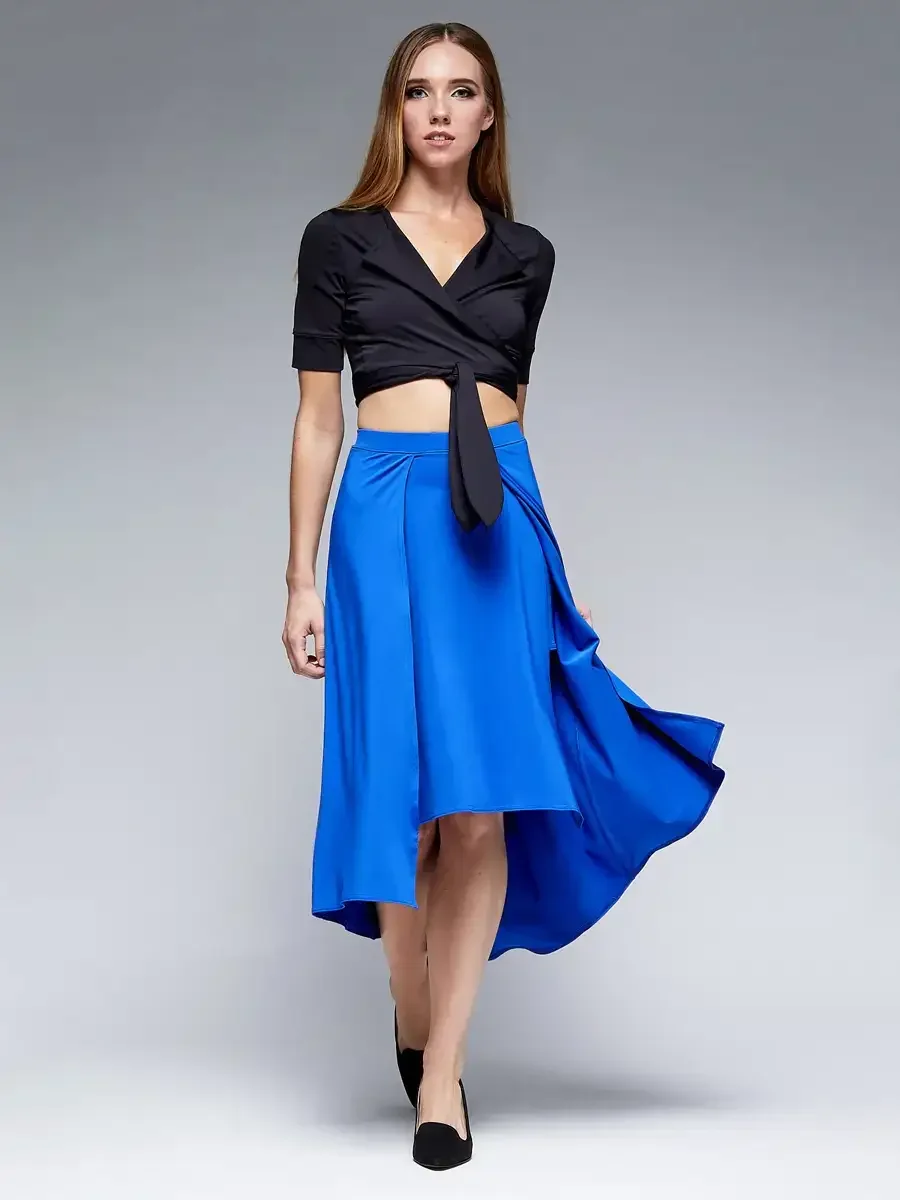 Fashion lookbook photography, black tied crop blazer with royal blue asymmetric hi-low midi skirt, gray background, photographed by Scott Parker Photo