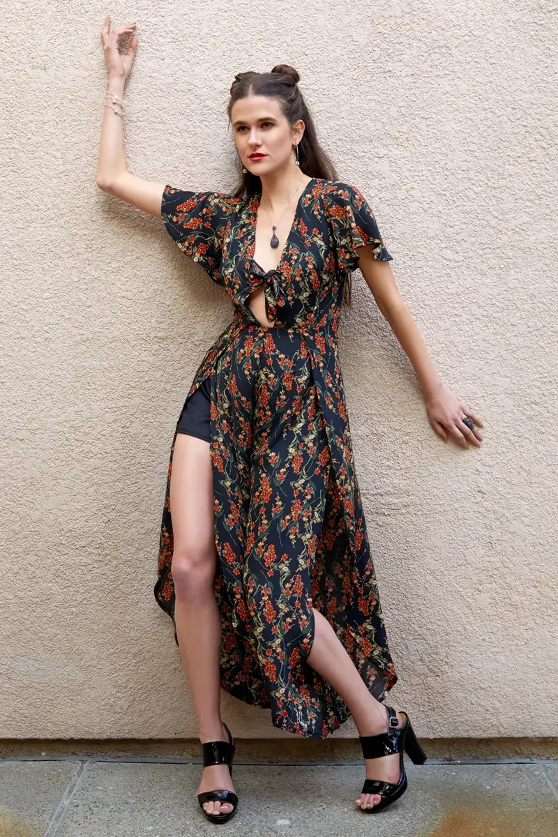 Victoria Henley, black floral maxi dress with skirt split, stucco wall, arm raised,Los Angeles fashion week test shoot, photographed by Scott Parker Photo