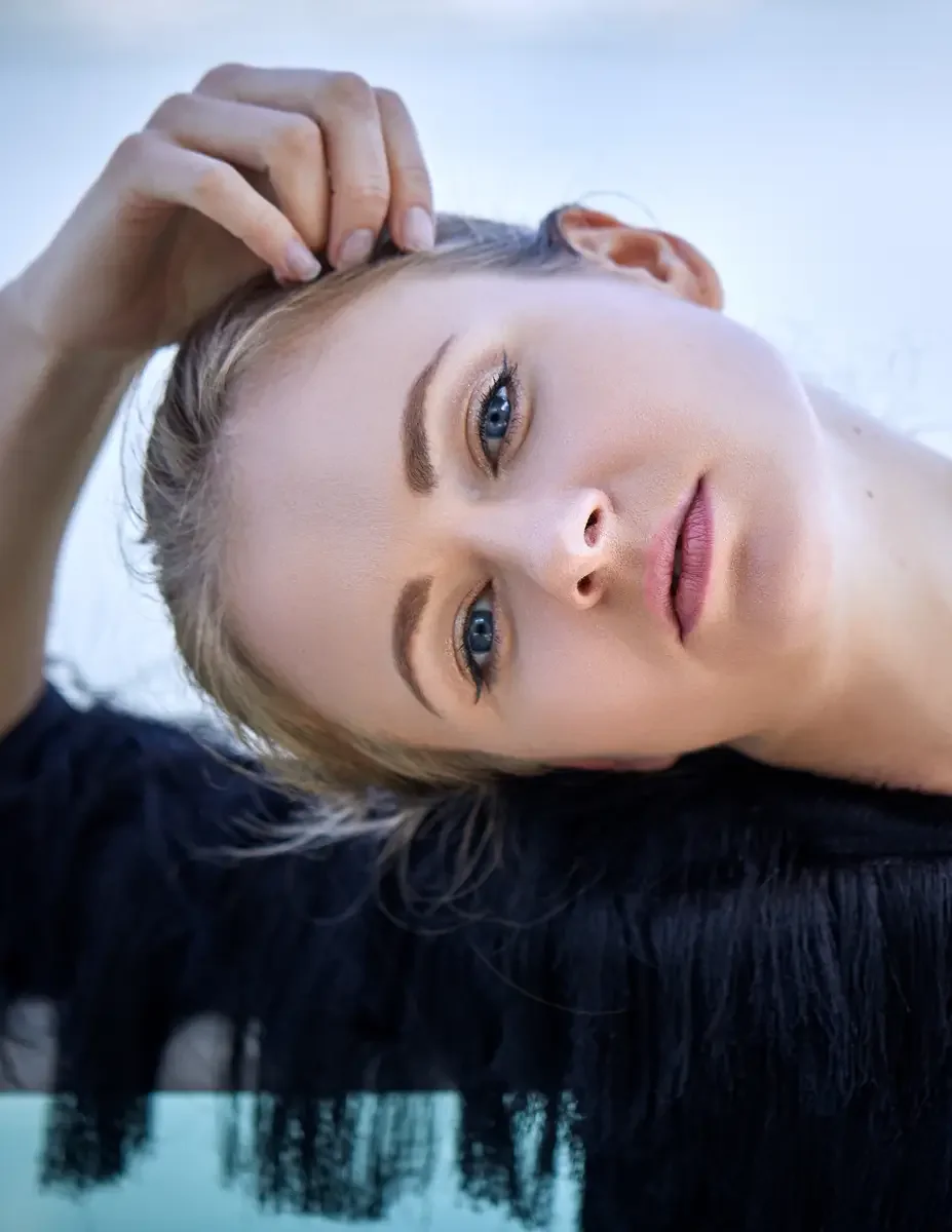 Julia, close-up portrait, hair up in a loose bun, black tiered fringe jacket with zip front, Jersey City rooftop test shoot, photographed by Scott Parker Photo