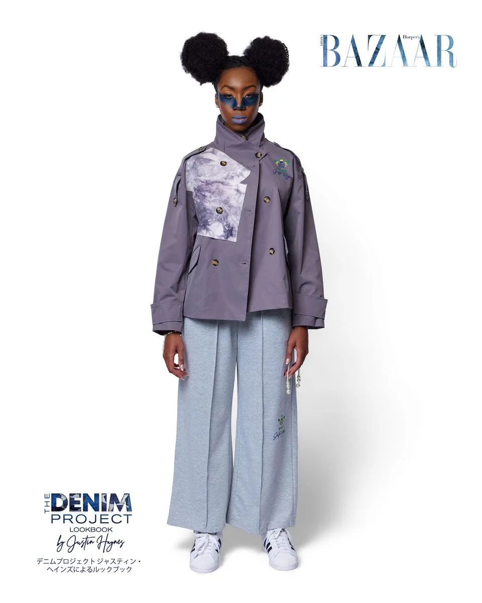 JUS10H Denim Project 2025 Harper's Bazaar Japan lookbook — model in slate purple double-breasted military-style jacket with large tie-dye inset panel and Adidas Brazil x JUS10H emblem over wide-leg grey marl trousers with Adidas script embroidery, bl