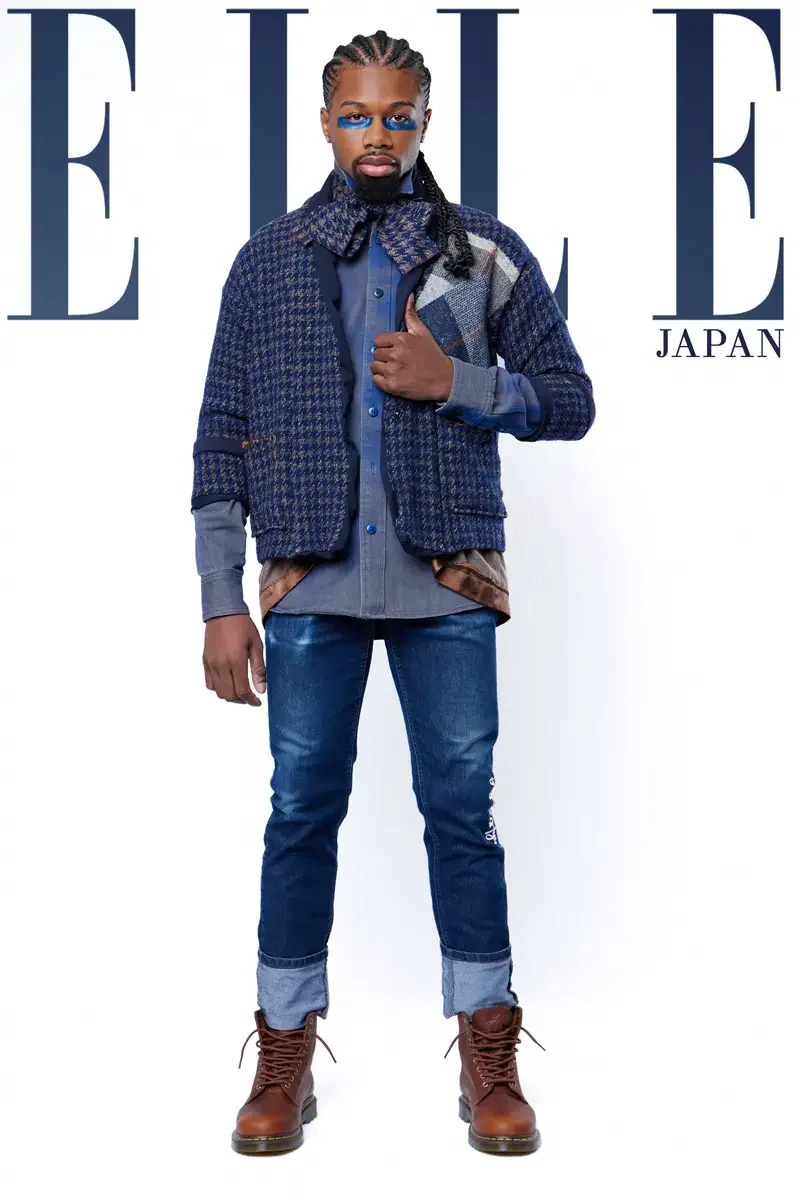 JUS10H 2024 Elle Japan feature, full-length editorial, navy houndstooth jacket and layered chambray, cuffed denim and brown lace-up boots, blue graphic eye makeup, photographed by Scott Parker Photo