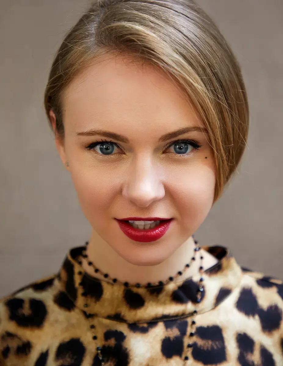 Julia, close-up portrait, leopard print satin dress with high mock neck, black bead choker with pendant necklace, hair slicked back with a side part, gold eye shadow, Upper East Side street test shoot, photographed by Scott Parker Photo