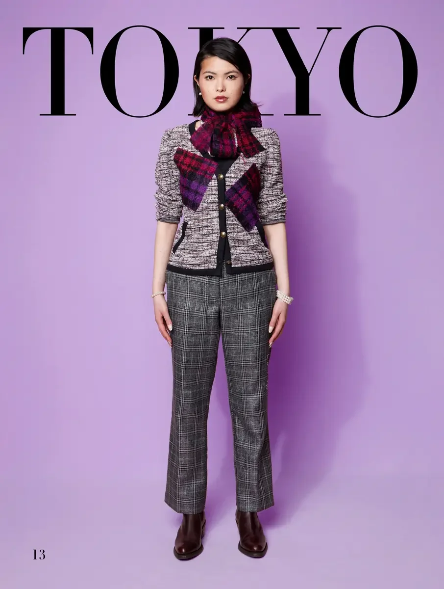 JUS10H 2025 Tokyo lookbook, white and pink boucle jacket with purple tartan scarf over glen plaid trousers and burgundy boots, lavender background, photographed by Scott Parker Photo for the Tokyo Fashion Council