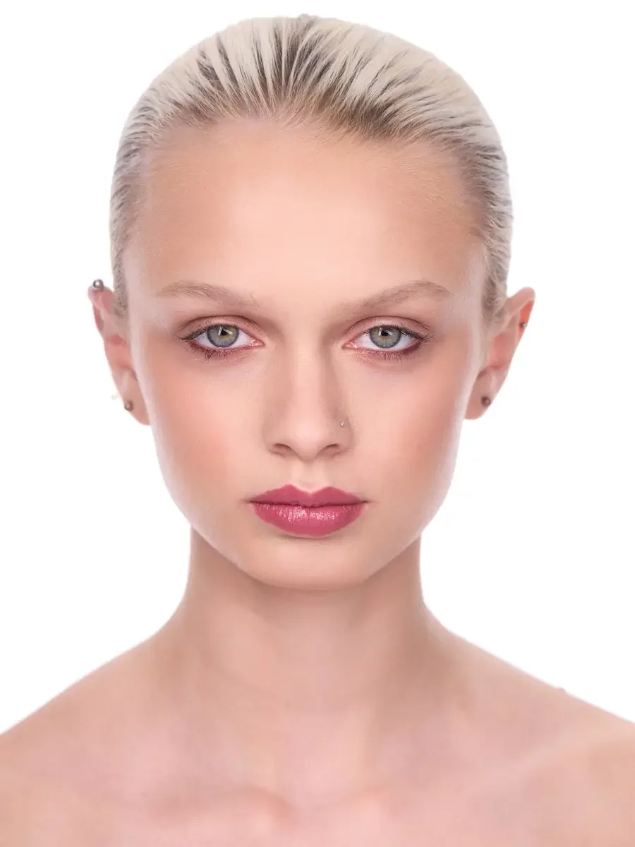 Model portfolio development session, beauty, close-crop, hair slicked back, direct gaze, rose lip, soft eye, bare shoulders, white background, photographed by Scott Parker Photo, New York