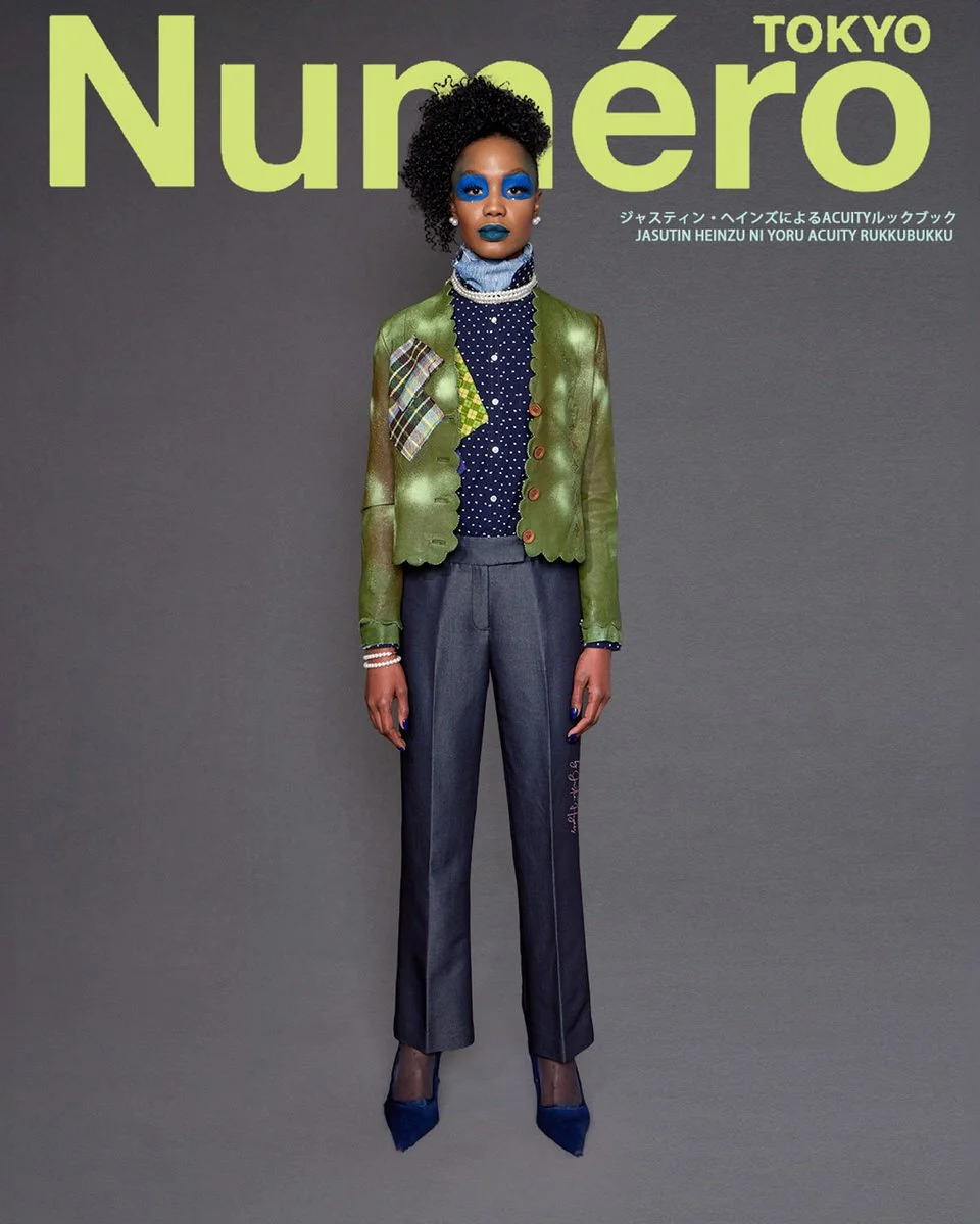JUS10H by Justin Haynes ACUITY Collection lookbook for Numéro Tokyo by Scott Parker — model in metallic olive green leather jacket with tartan and checkered patch pockets, layered over navy and white polka-dot blouse and chambray turtleneck, paired w