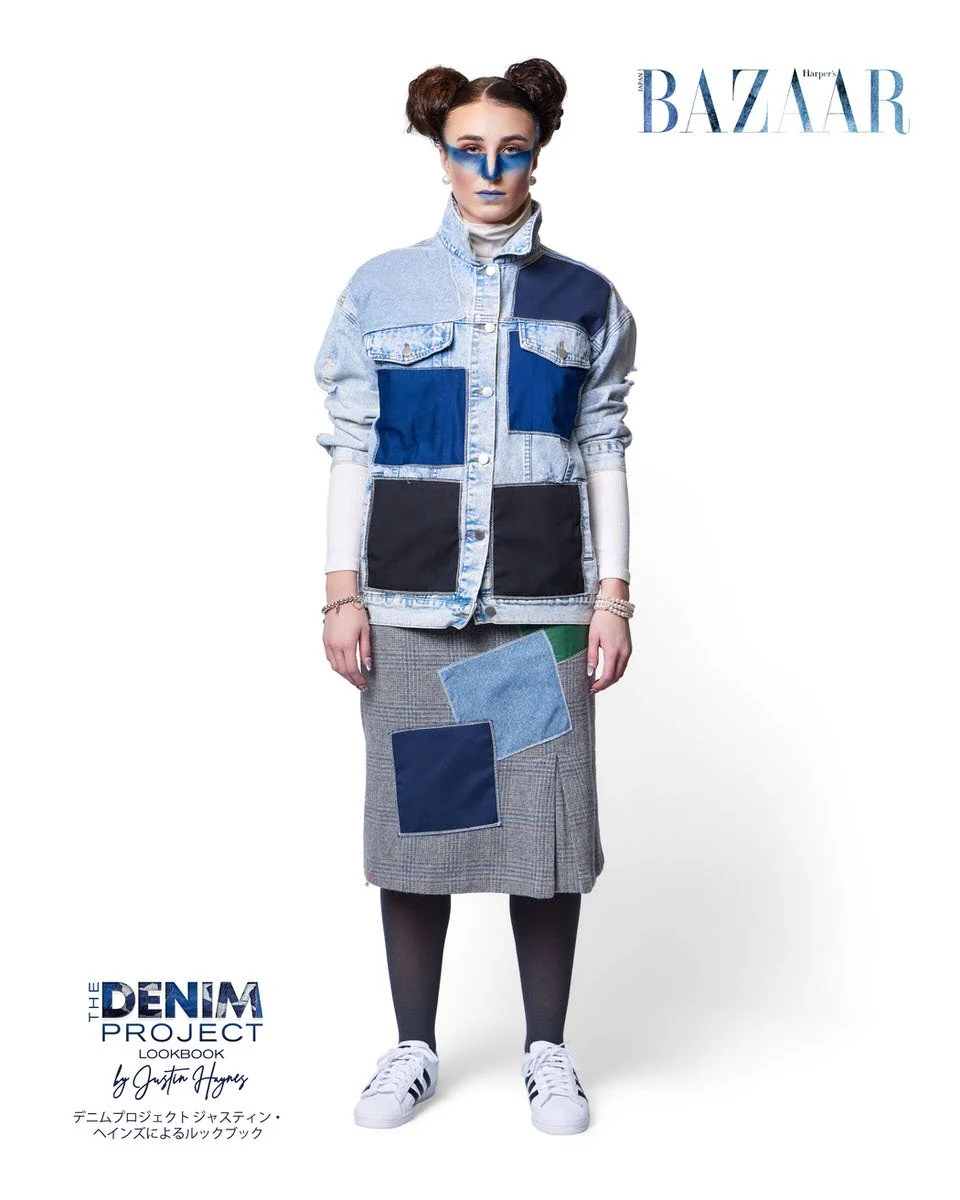 

JUS10H Denim Project 2025 Harper's Bazaar Japan lookbook — model in bleached light-wash oversized denim jacket with bold navy and charcoal block patchwork panels over a white ribbed turtleneck, paired with grey glen plaid midi skirt with denim and 