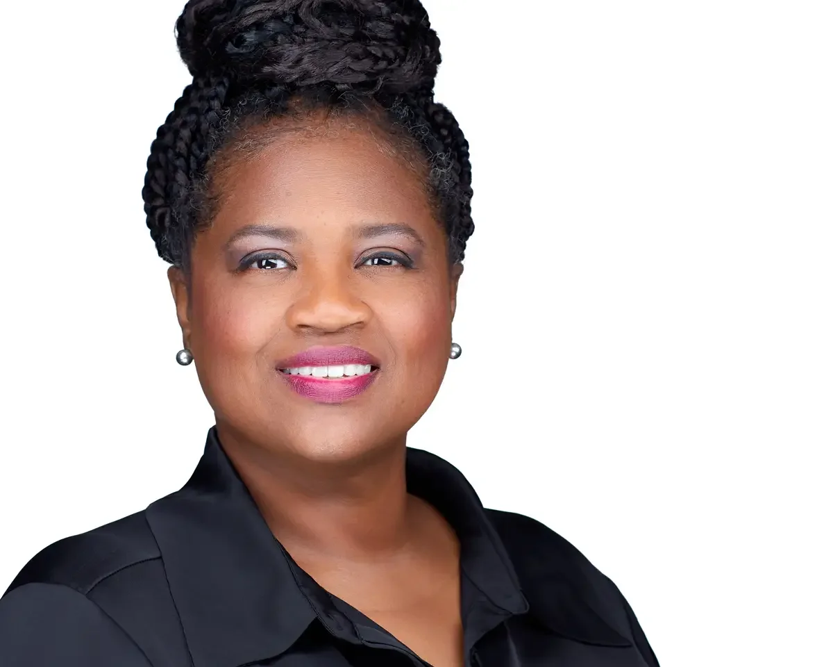 Wealth manager headshot, black top, warm direct expression, white background, Hartford Connecticut, photographed by Scott Parker Photo