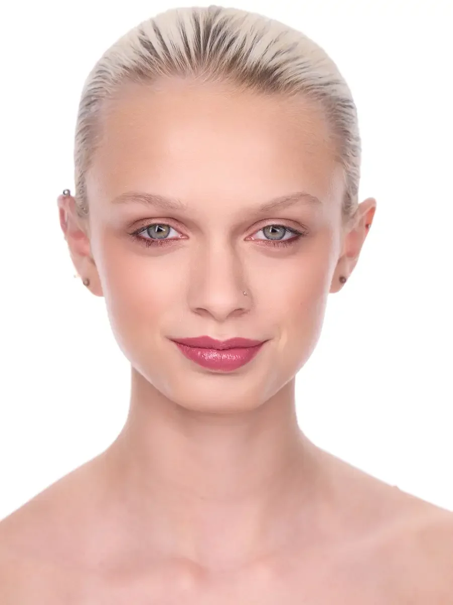 Model portfolio development session, beauty, close-crop, hair slicked back, soft smile, direct gaze, rose lip, soft eye, bare shoulders, white background, photographed by Scott Parker Photo, New York